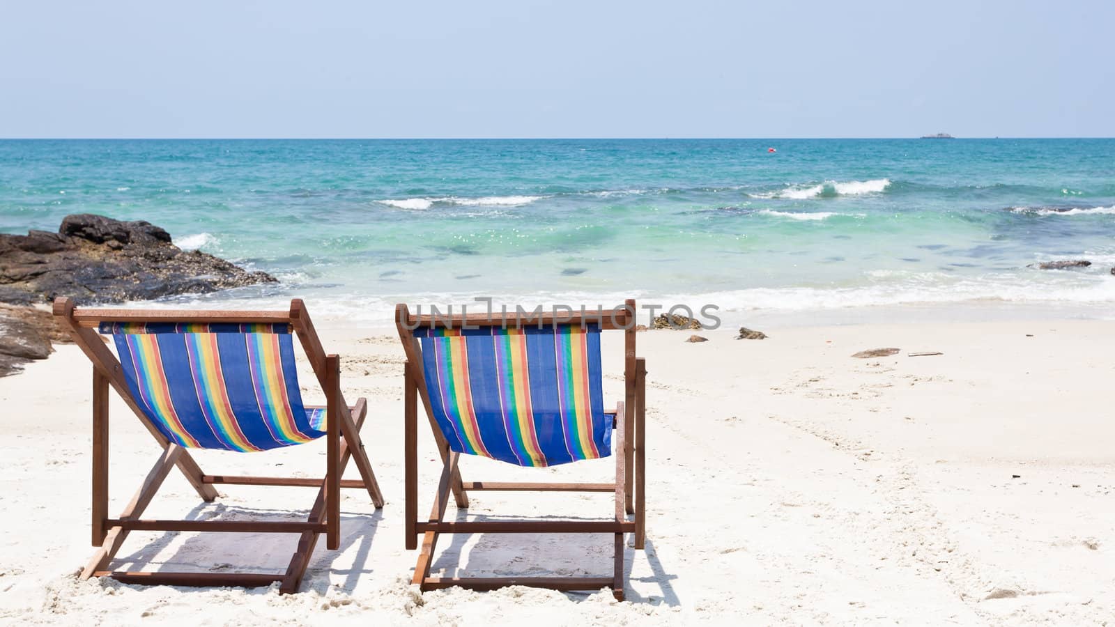 beach chair on white sand beach