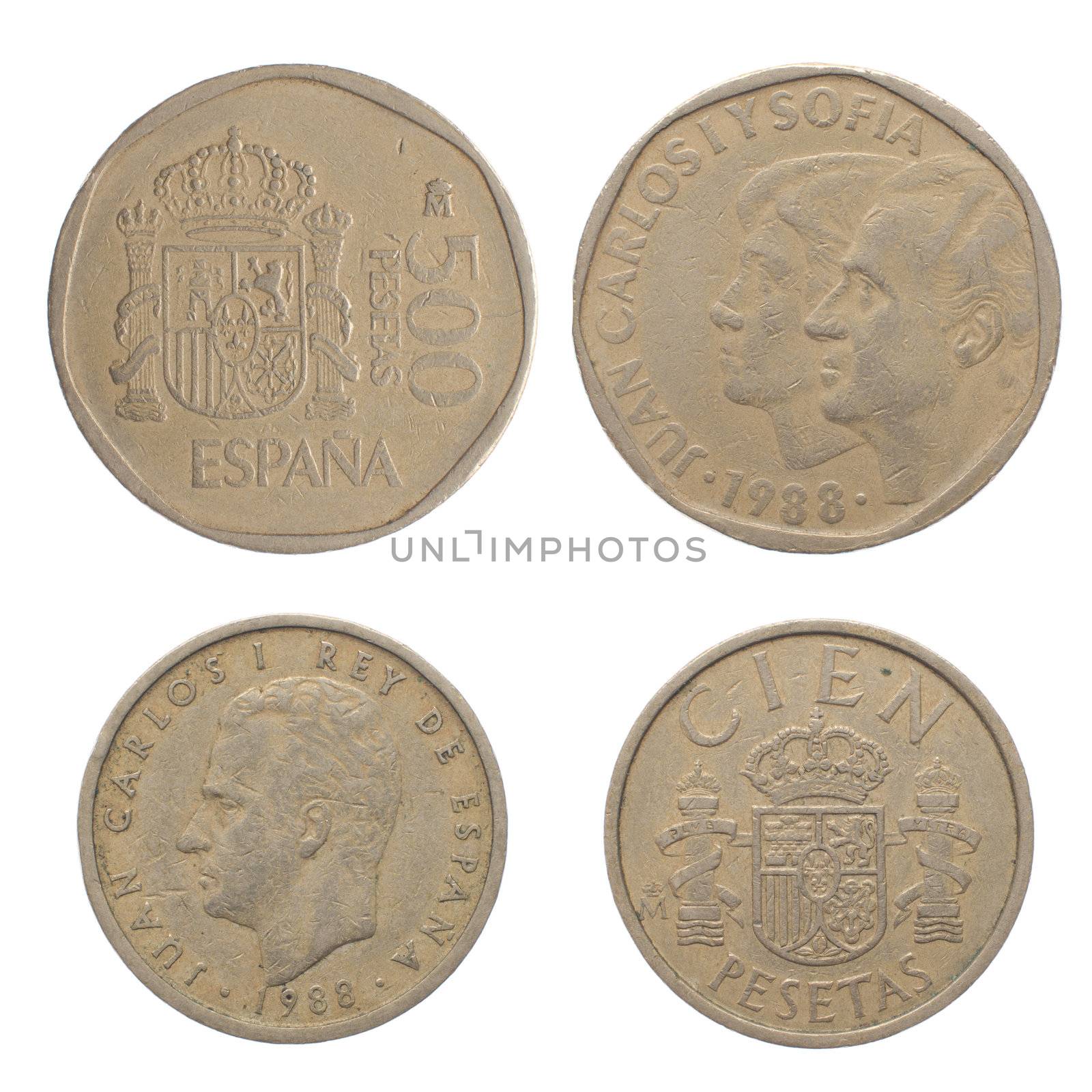 Close up top view of old Spanish coins isolated on white background.