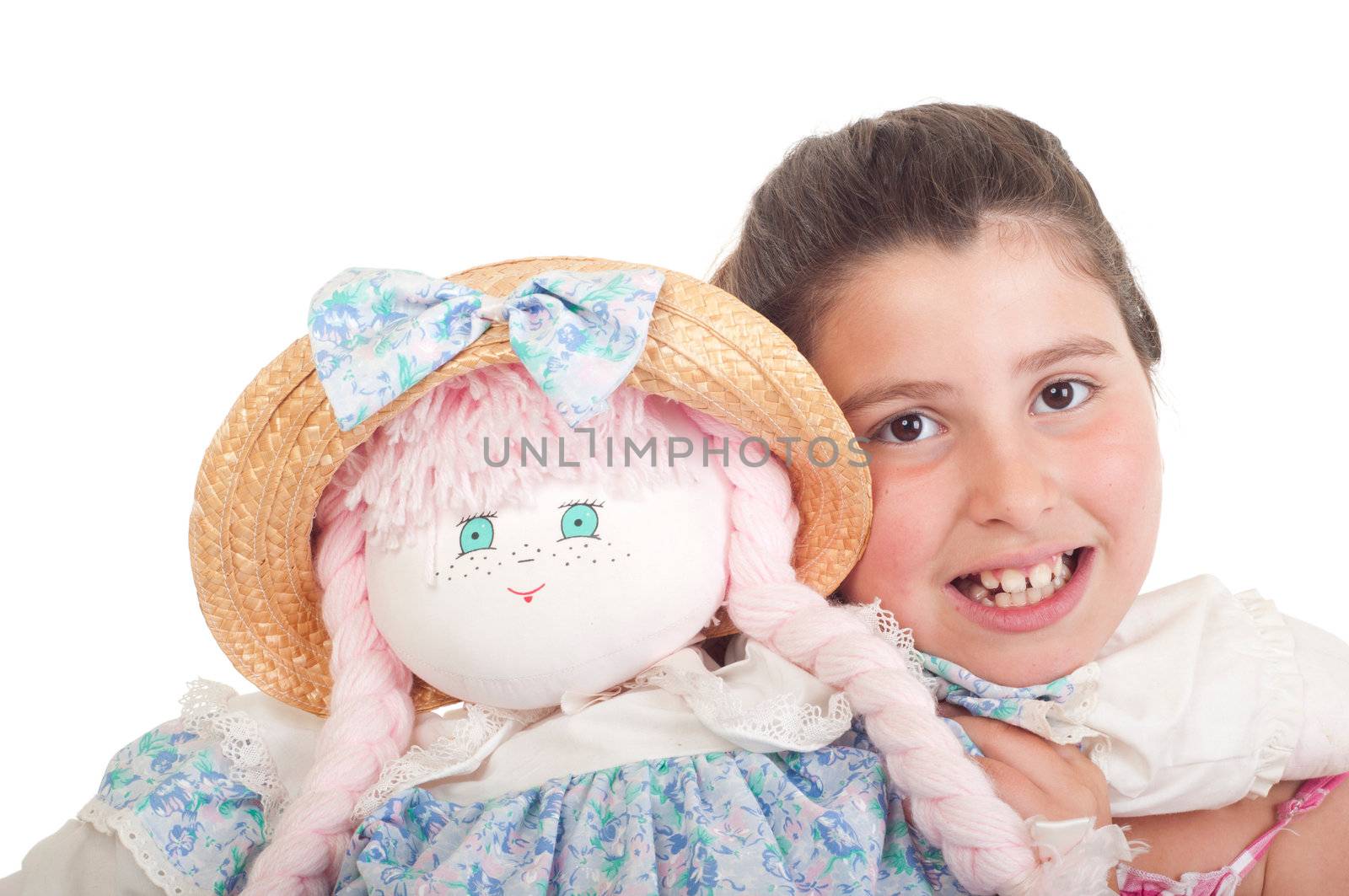 joyful little girl with her favorite doll (isolated on white background) 