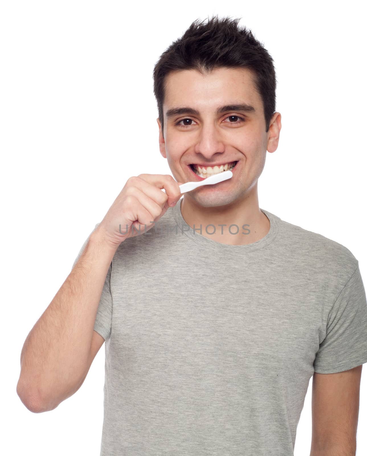 handsome young man brushing his teeth with toothbrush (isolated on white background)
