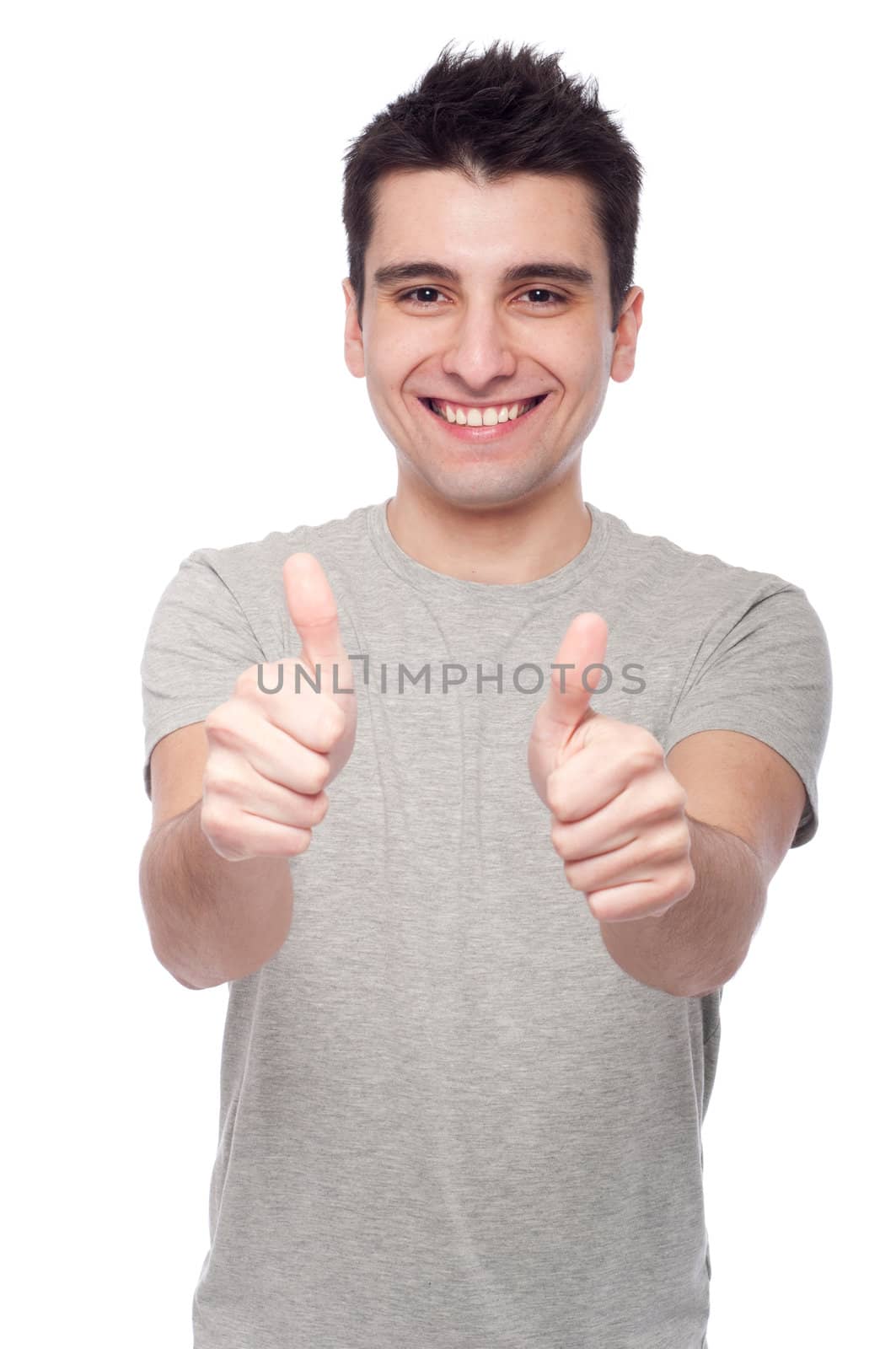 handsome young man with thumbs up on an isolated white background