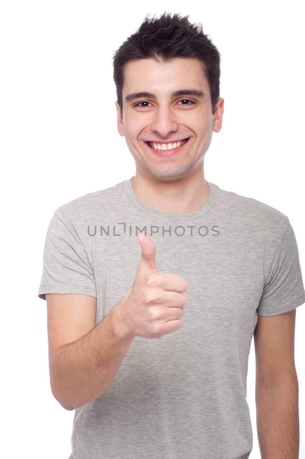 handsome young man with thumbs up on an isolated white background