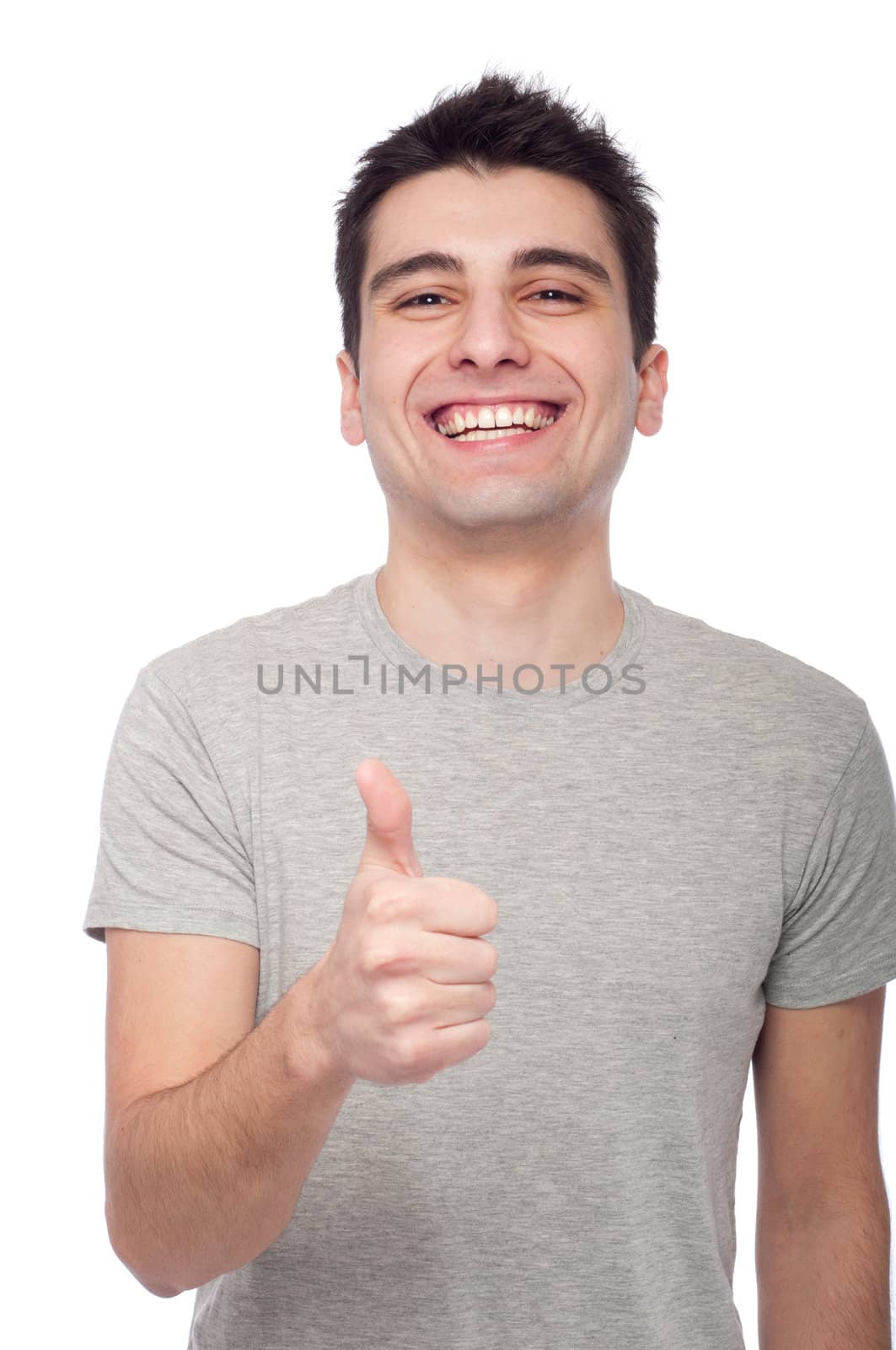 handsome young man with thumbs up on an isolated white background