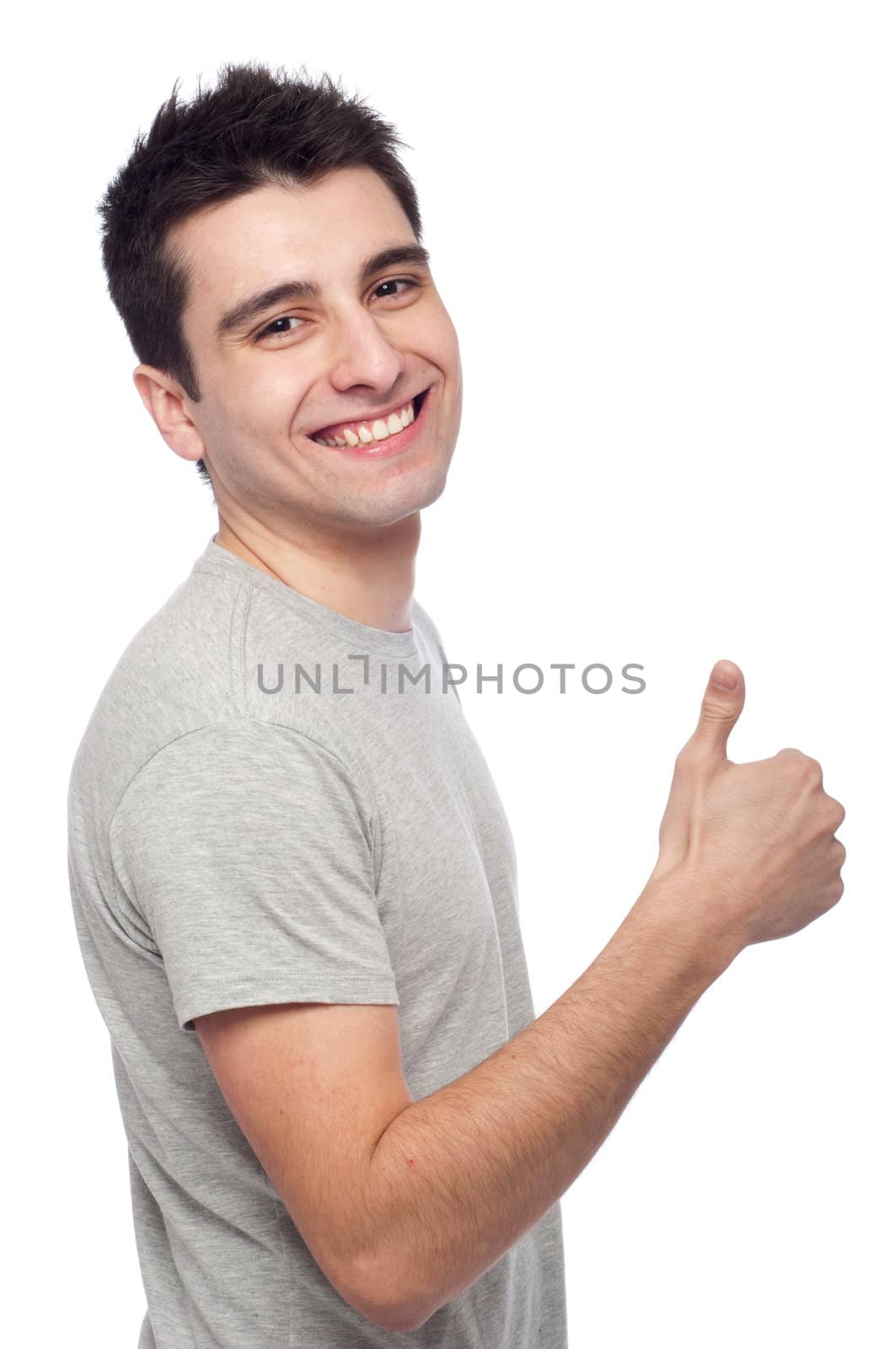 handsome young man with thumbs up on an isolated white background