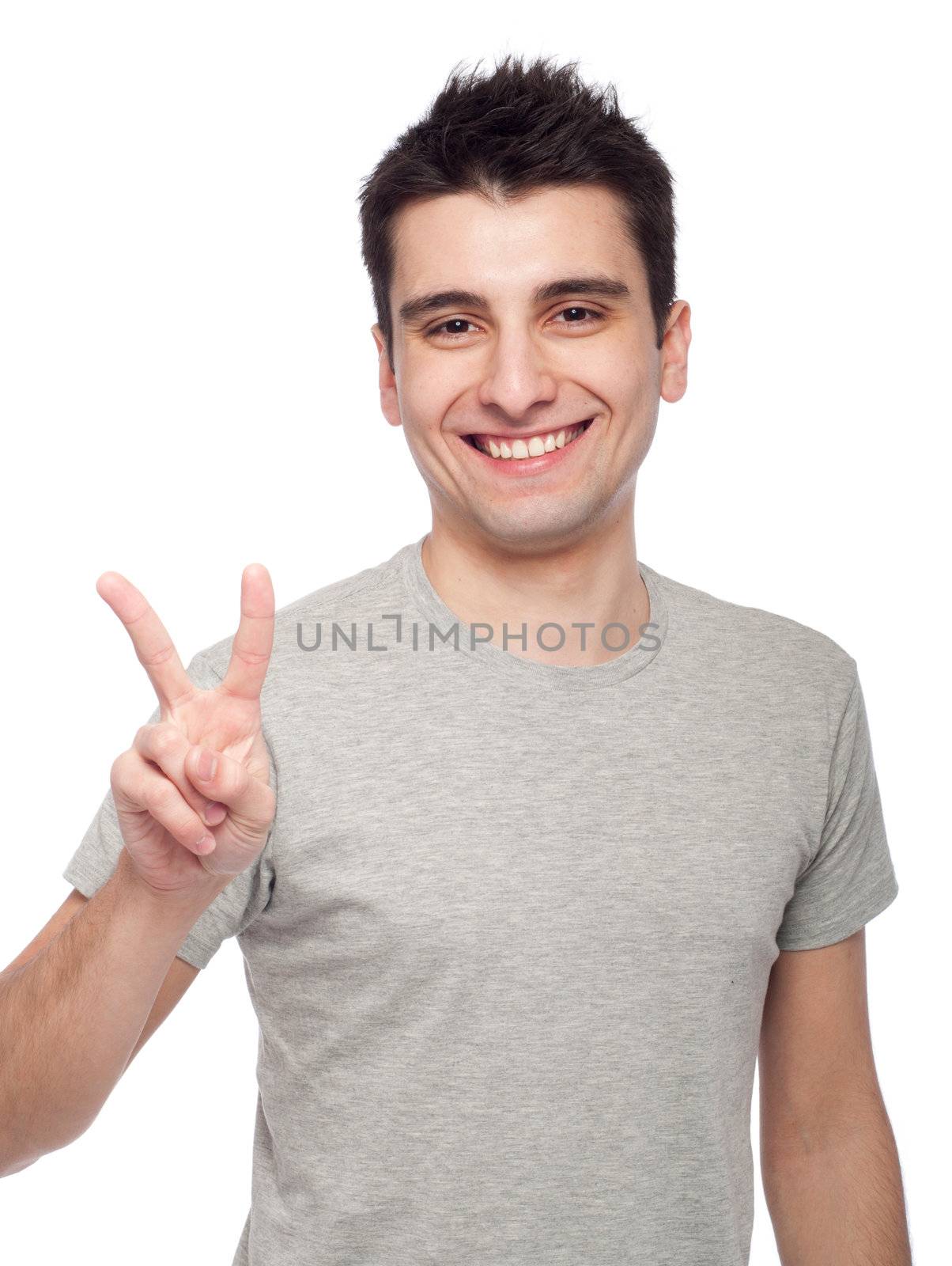 handsome young man showing victory fingers sign (isolated on white background)