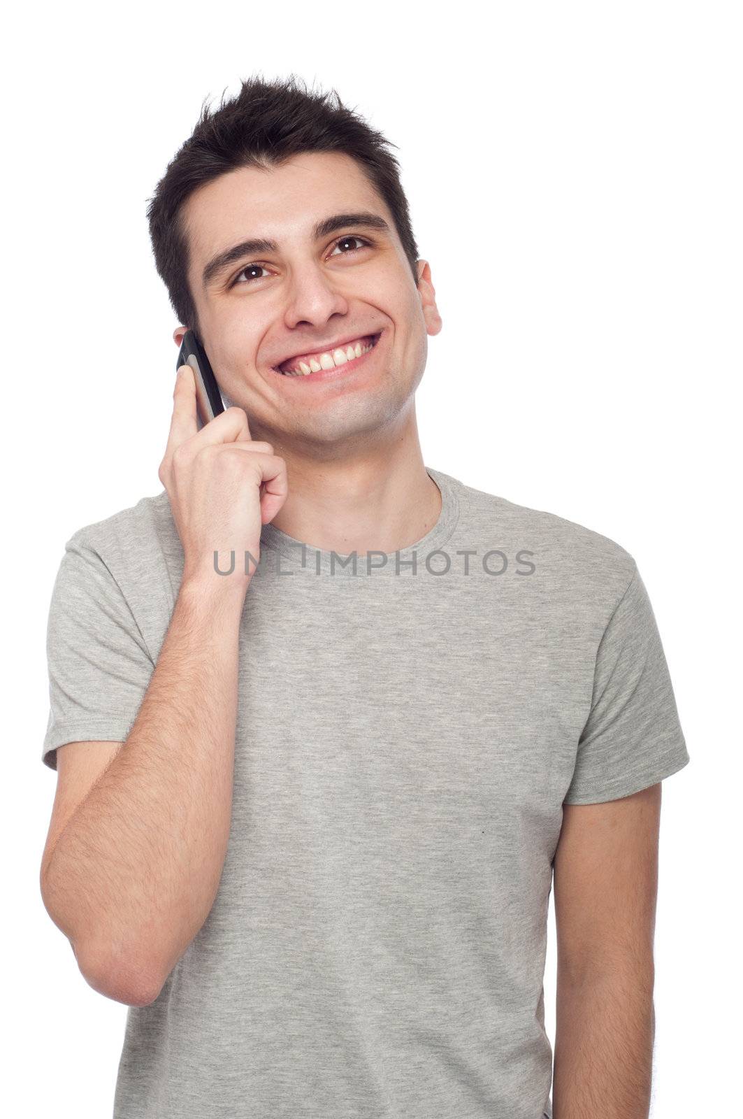 young casual man talking on the phone isolated on white background 