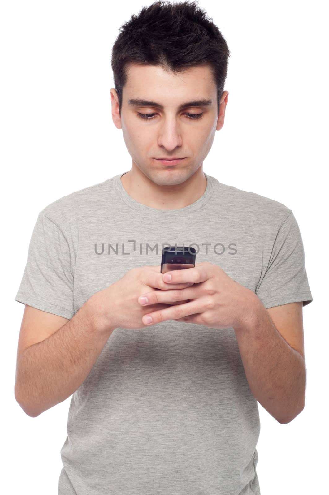 young casual man sending a text message isolated on white background 