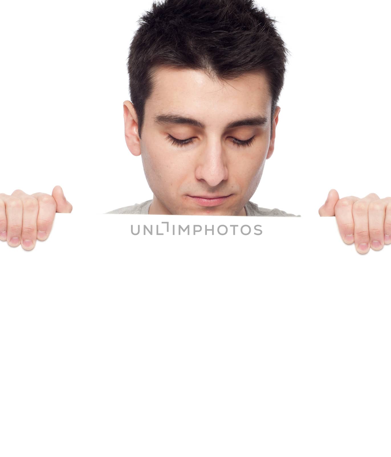 handsome young man displaying a banner ad isolated on white background 