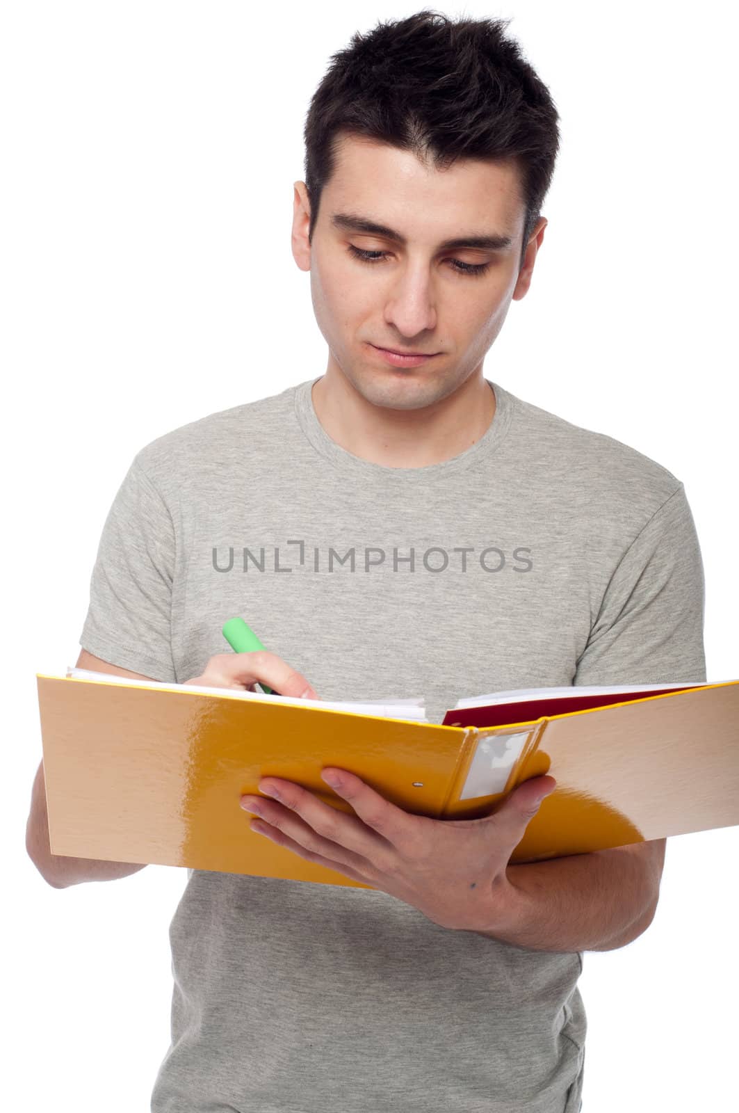 handsome young man studying with a dossier (isolated on white background)