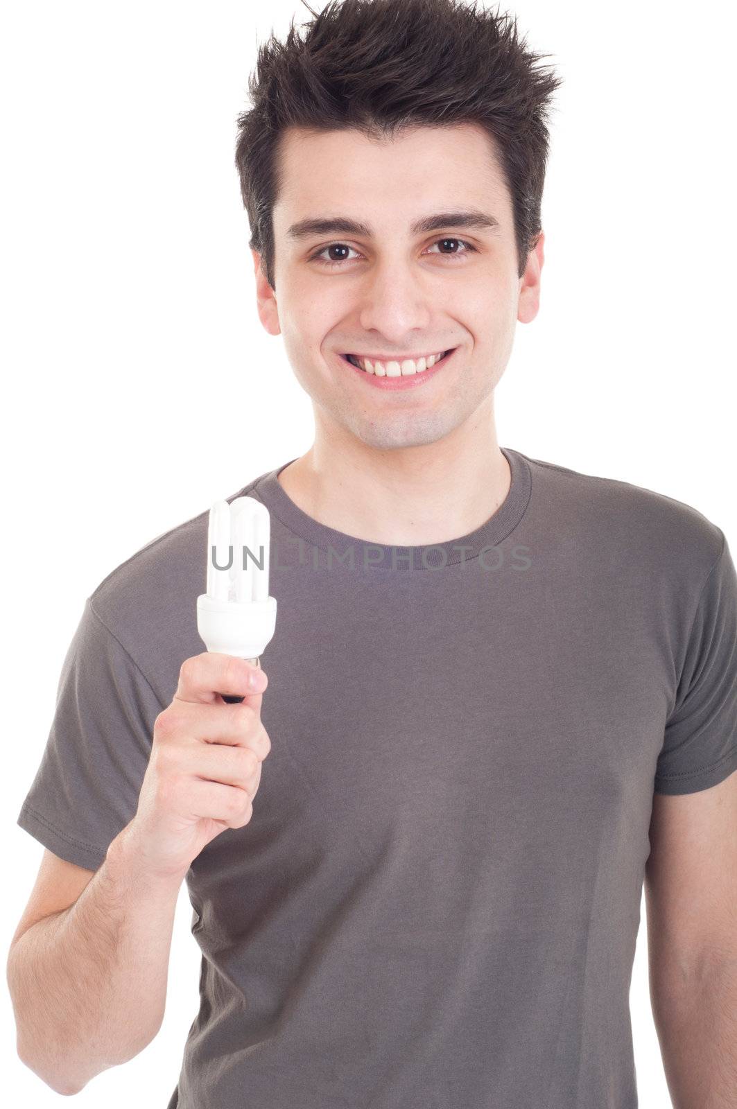 smiling casual man holding a energy-saving lightbulb isolated on white background