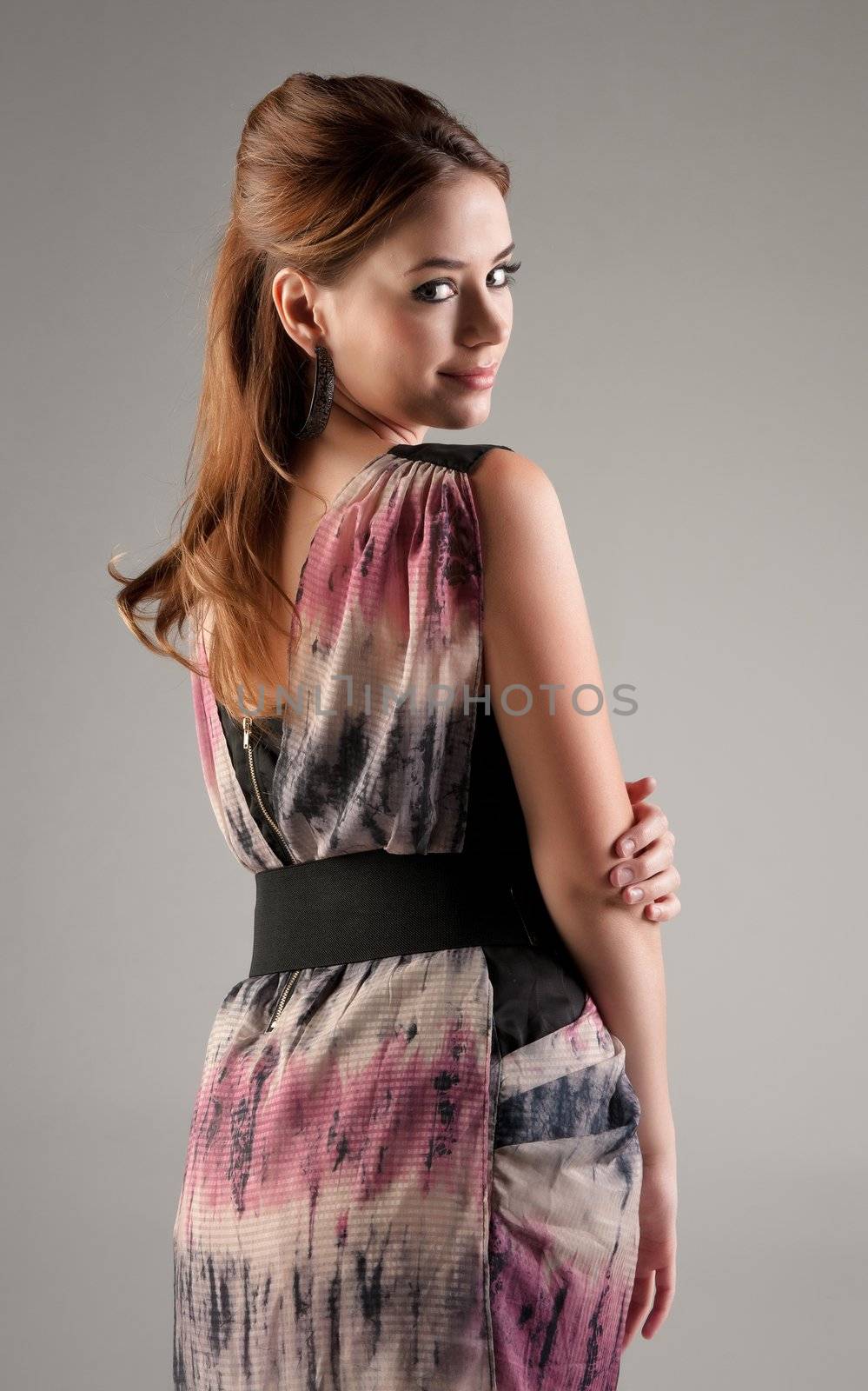 beautiful young fashion model woman on grey background