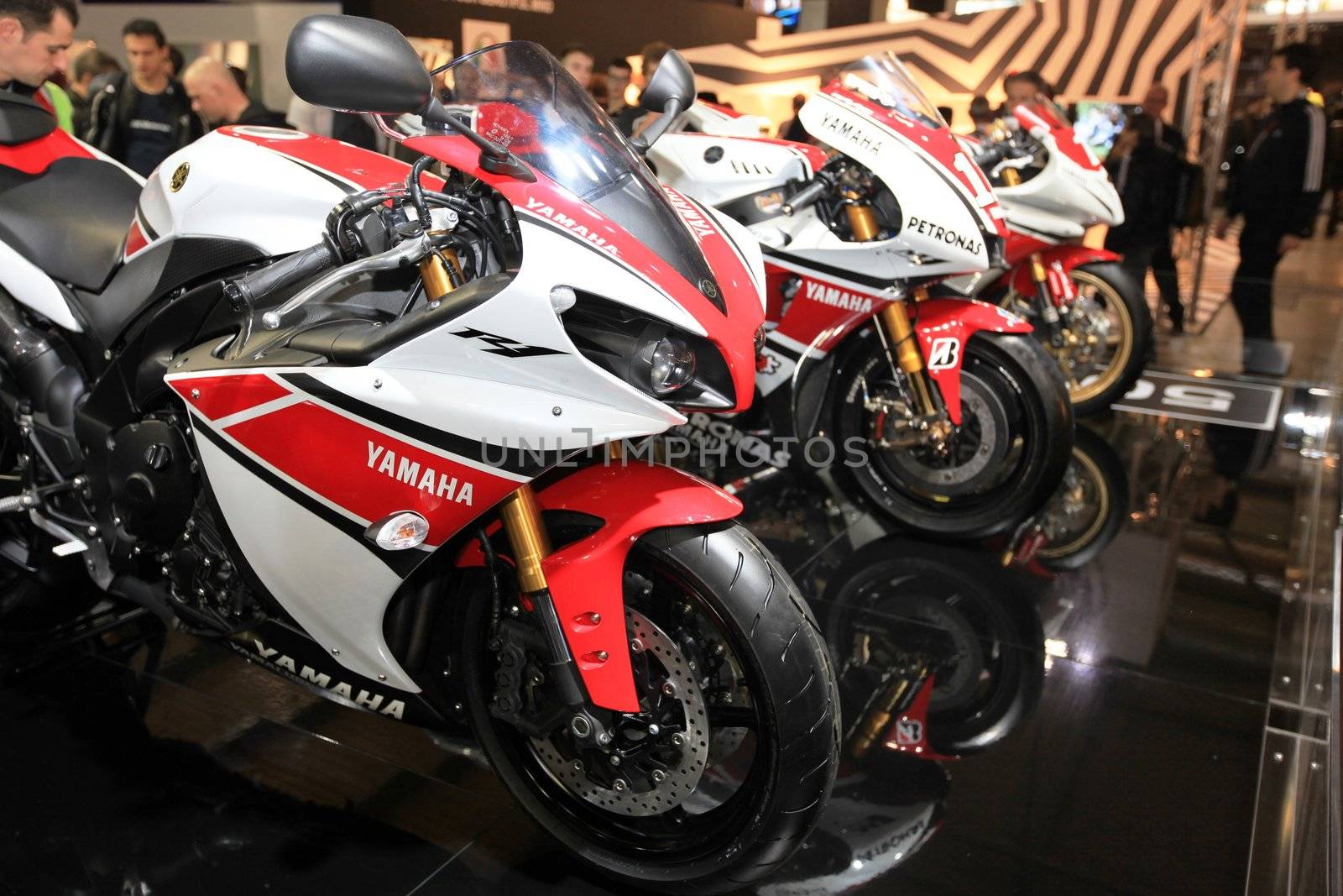 Looking at SBK Yamaha motorcycels during EICMA 2011, International Motorcycle Exhibition in Milan, Italy