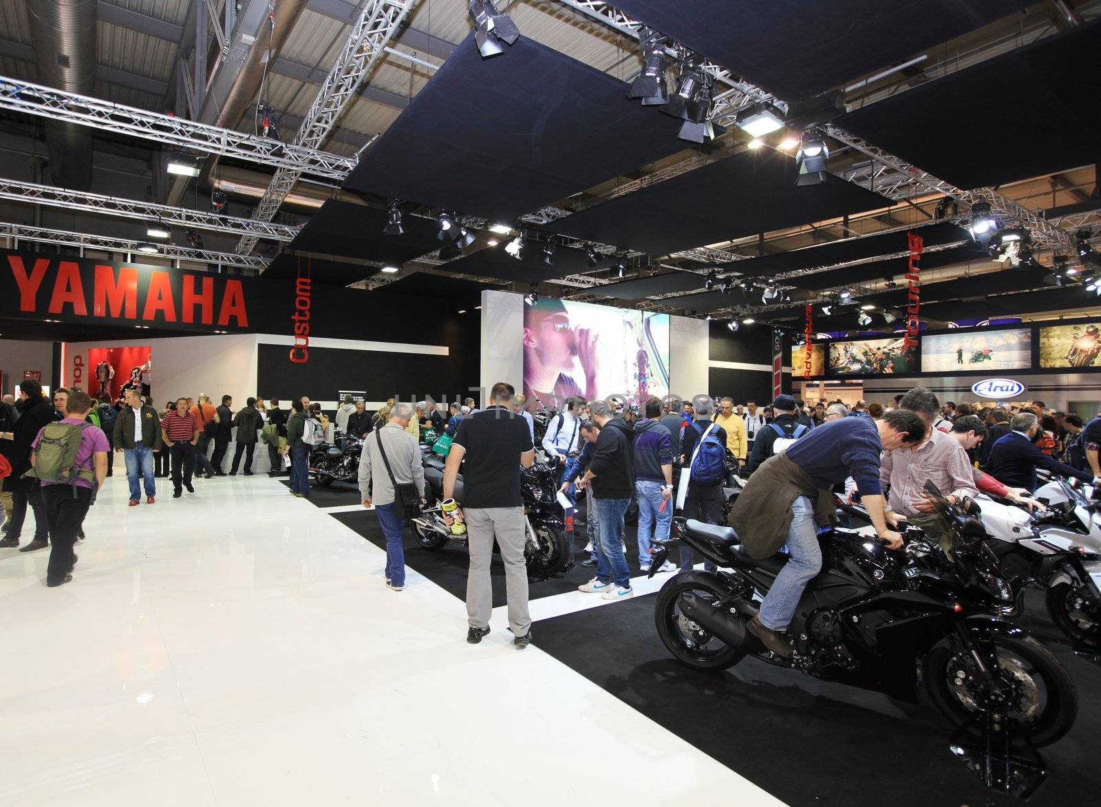 People visit motorcycels stands during EICMA 2011, International Motorcycle Exhibition in Milan, Italy