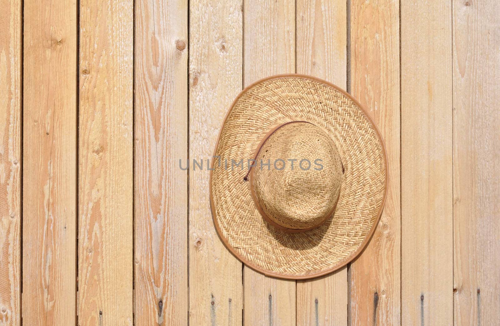 Straw hat on wall by alexcoolok
