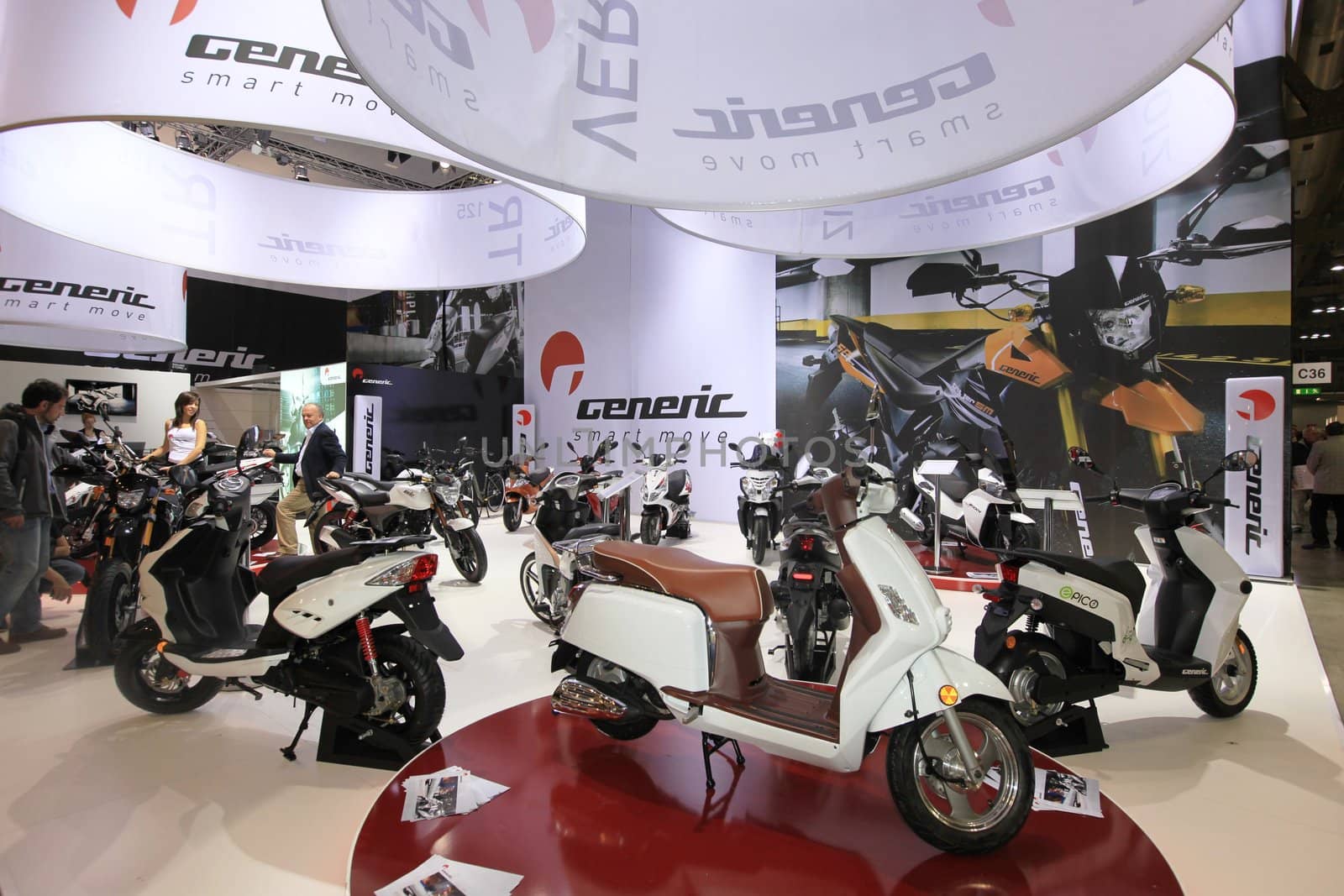 Visiting scooters and motorcycels stands during EICMA 2011, International Motorcycle Exhibition in Milan, Italy