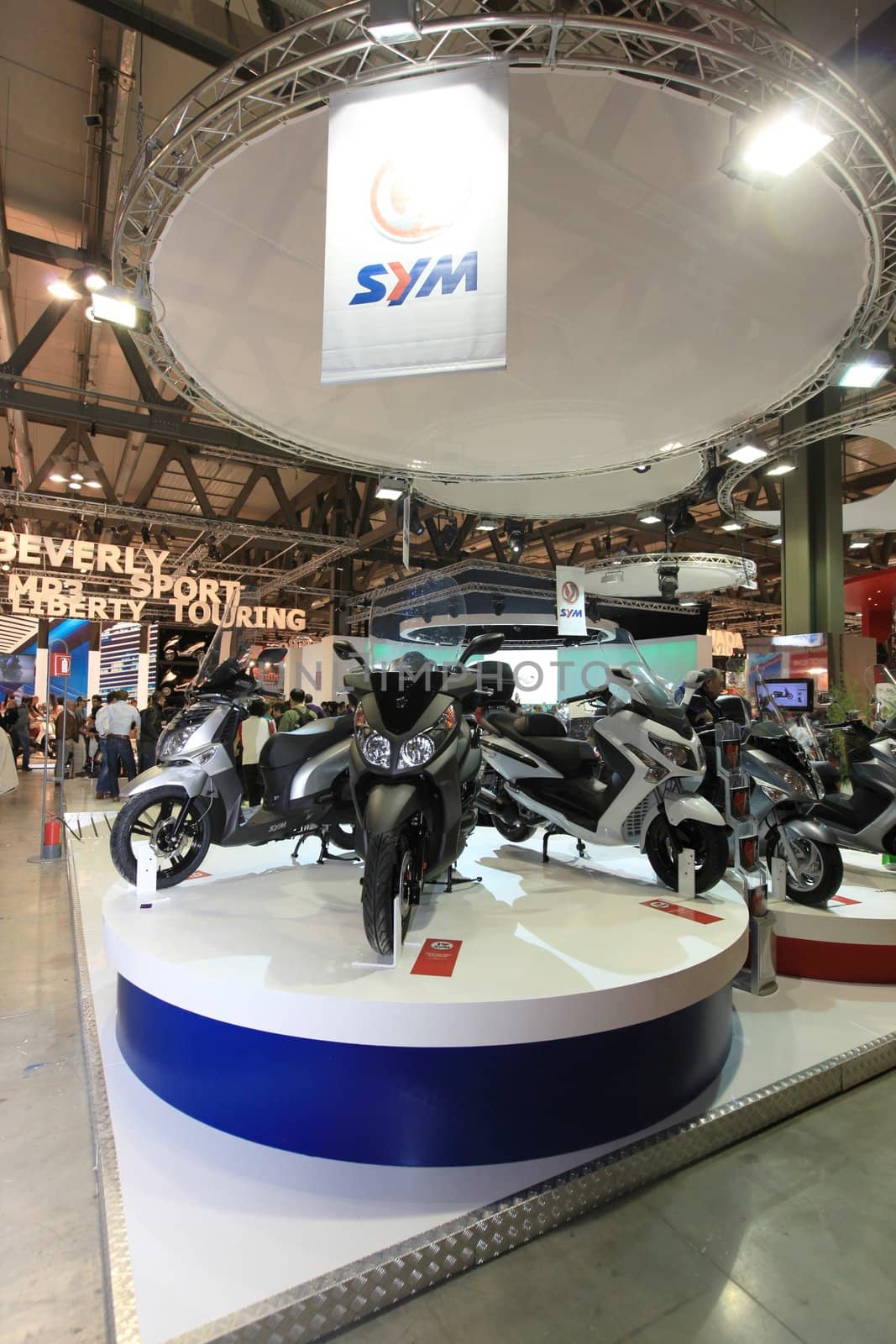 Visiting scooters and motorcycels stands during EICMA 2011, International Motorcycle Exhibition in Milan, Italy