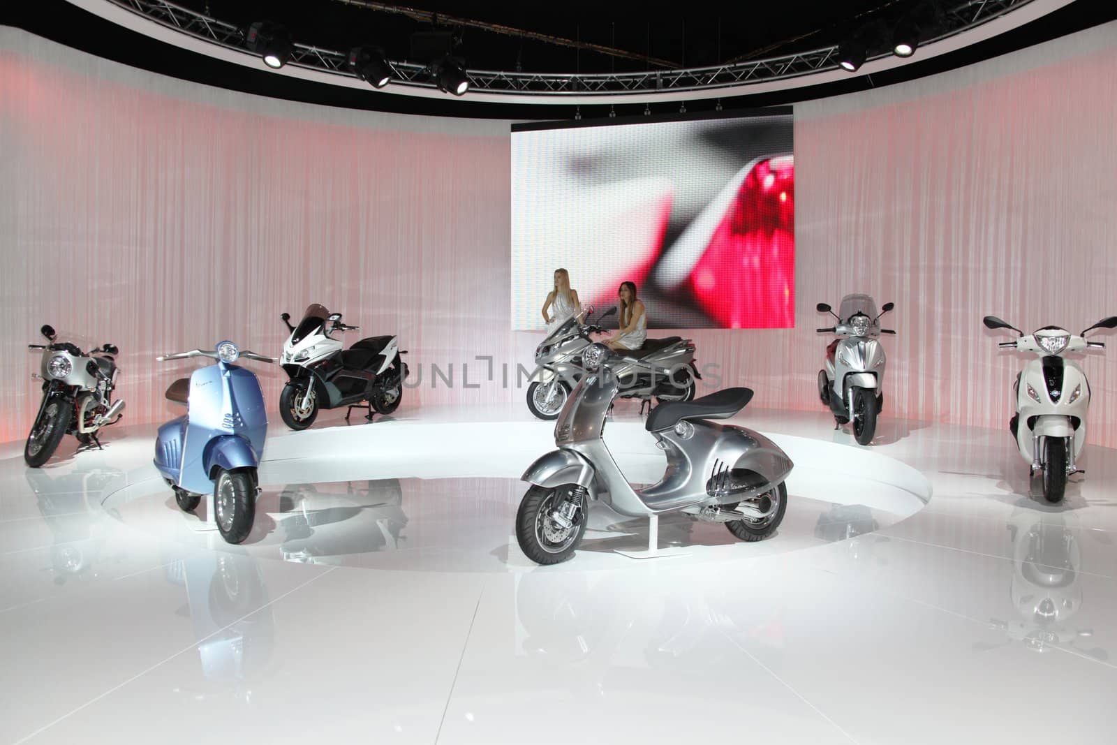 Visiting scooters and motorcycels stands during EICMA 2011, International Motorcycle Exhibition in Milan, Italy