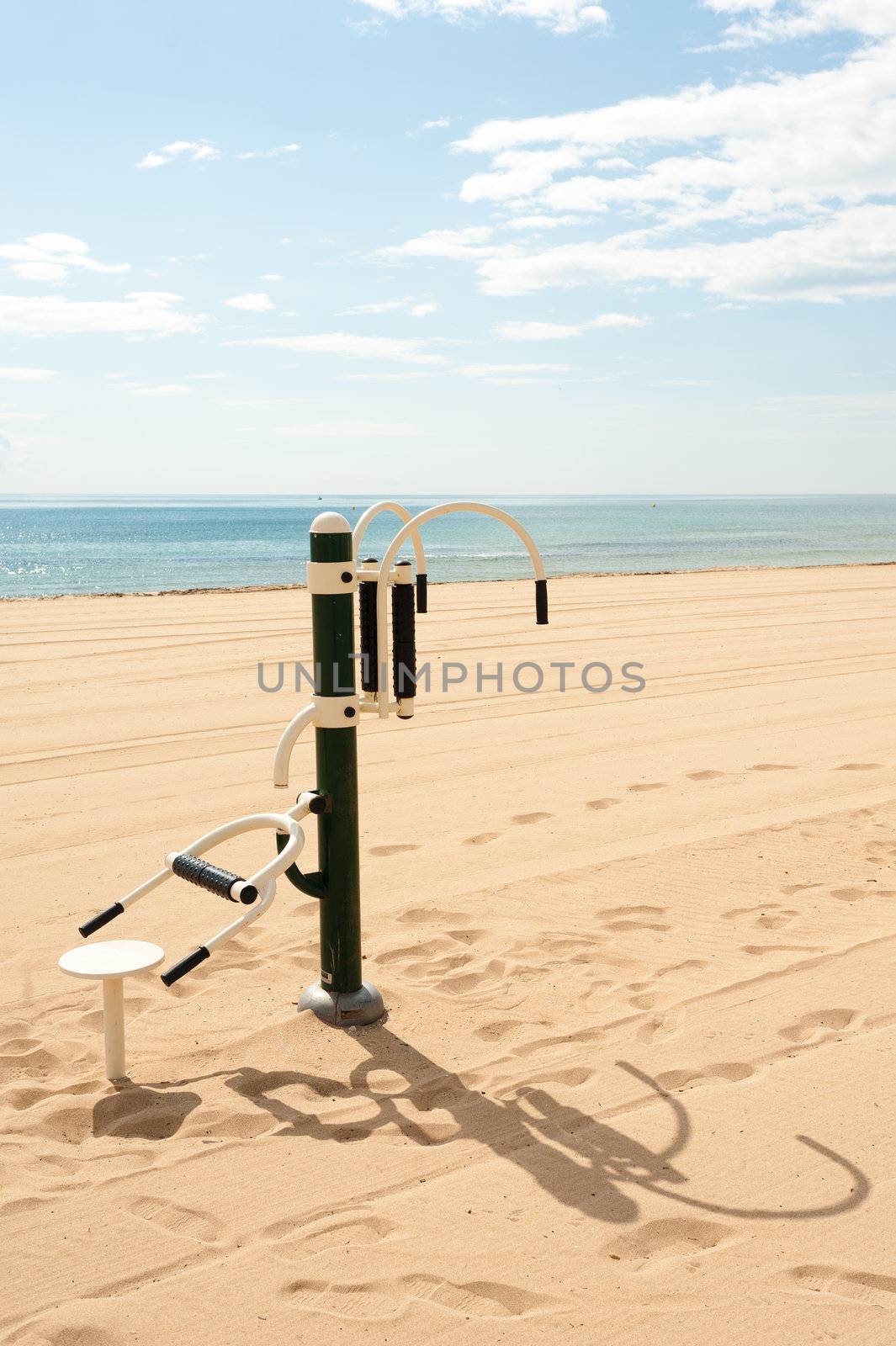 Fitmess machine outdoors on a sunny Mediterranean beach