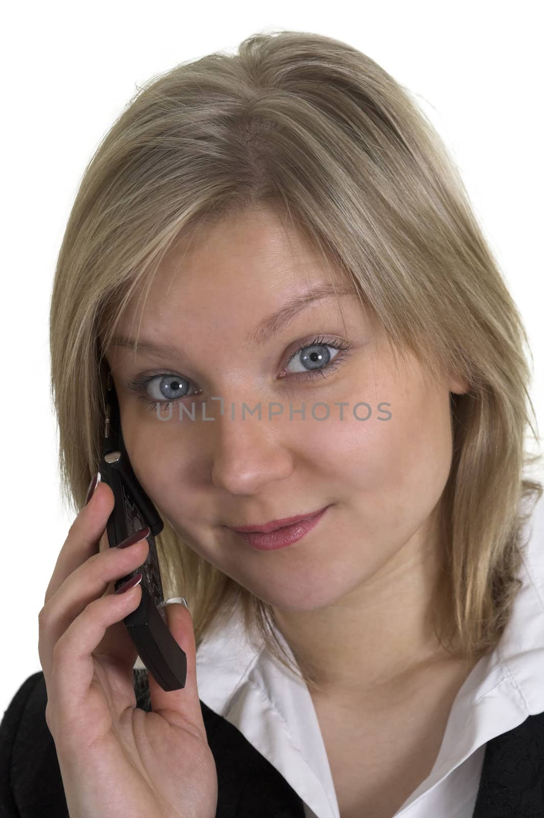 Head portrait of an attractive business woman talking on a cellular phone and looking in the camera; isolated on white