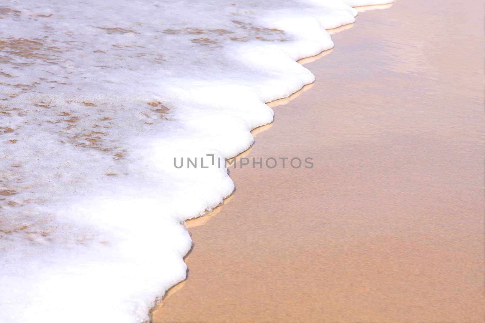 Surf washing up on the beach by svanblar