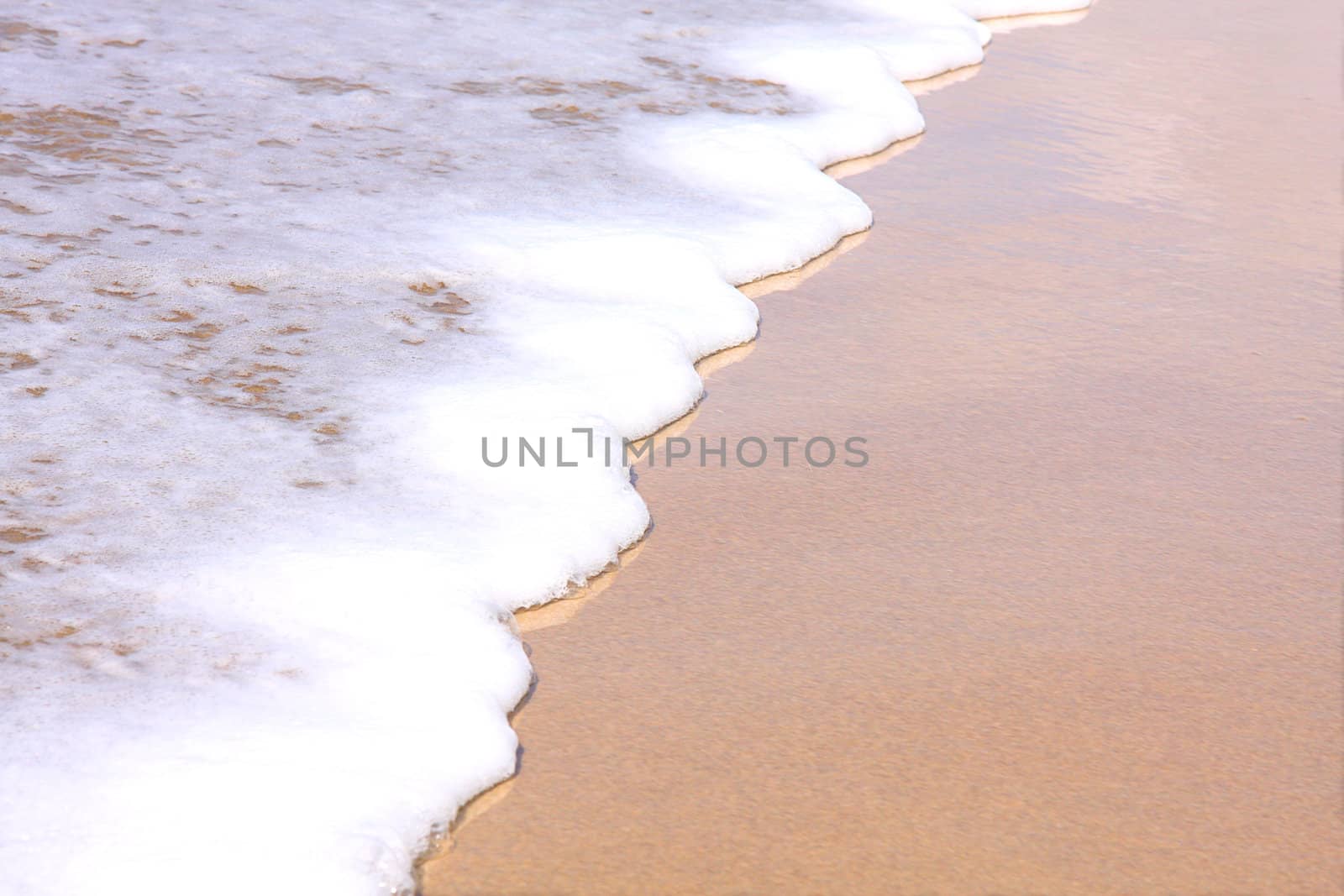 Beautiful white surf washing up on the beach