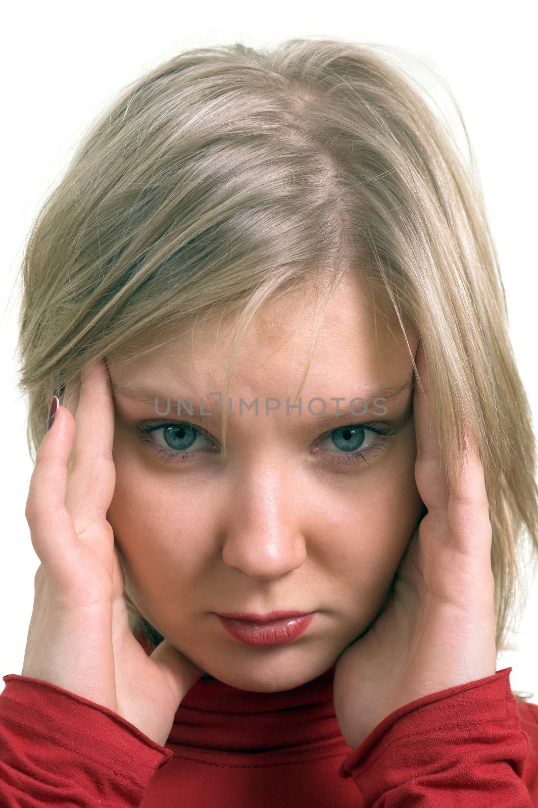 Portrait of a young adult woman suffering from headache; isolated on white.