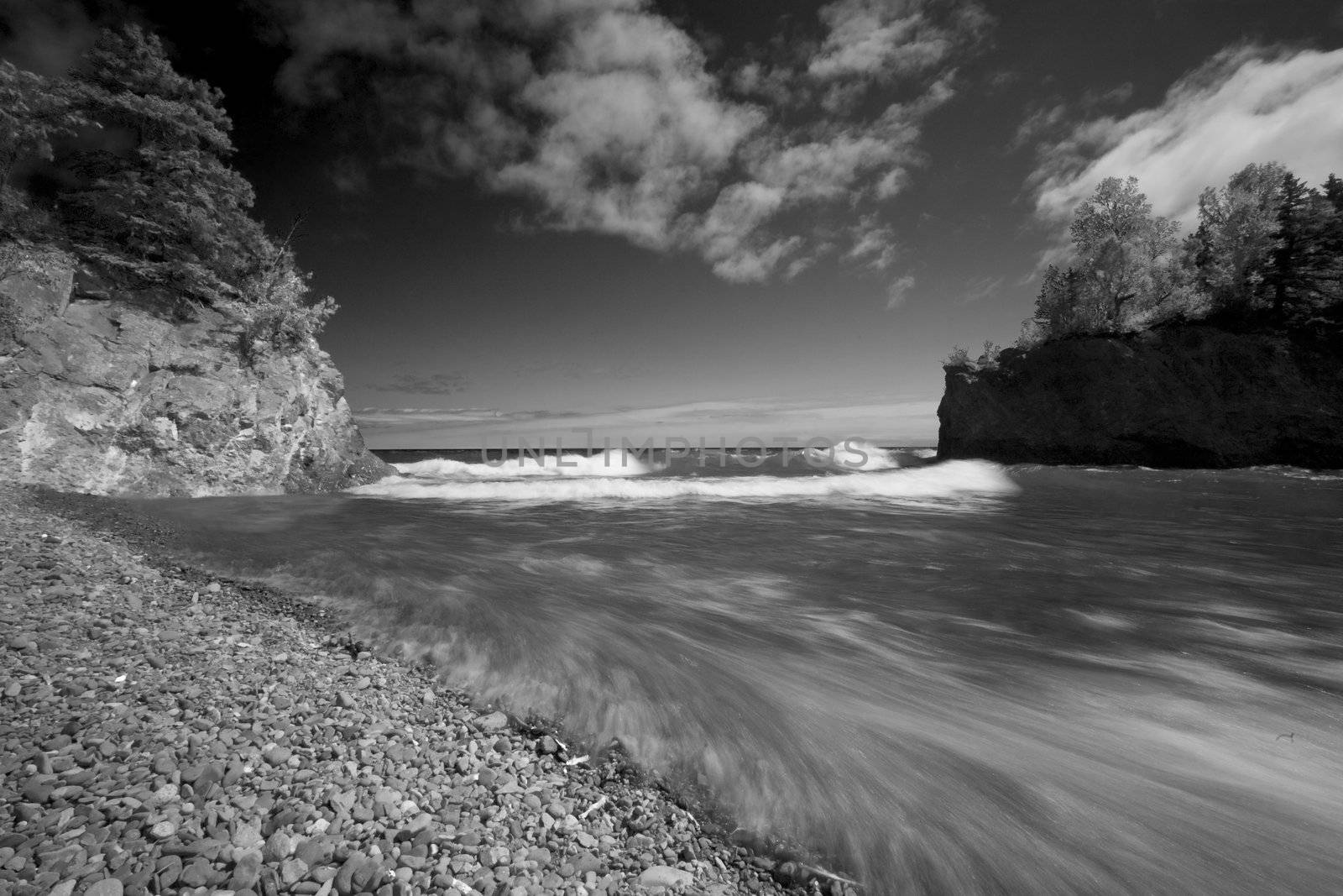 Waves explode into the mouth of the Baptism river along the North Shore of Lake Superior.