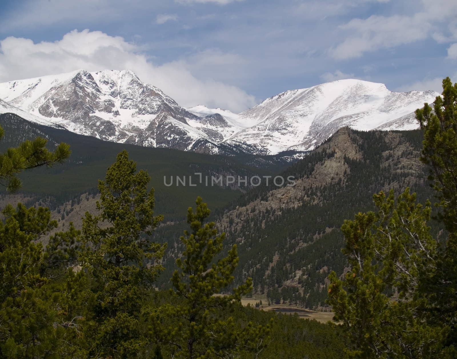 Two peaks over a distant valley in Rocky Mountain National Park