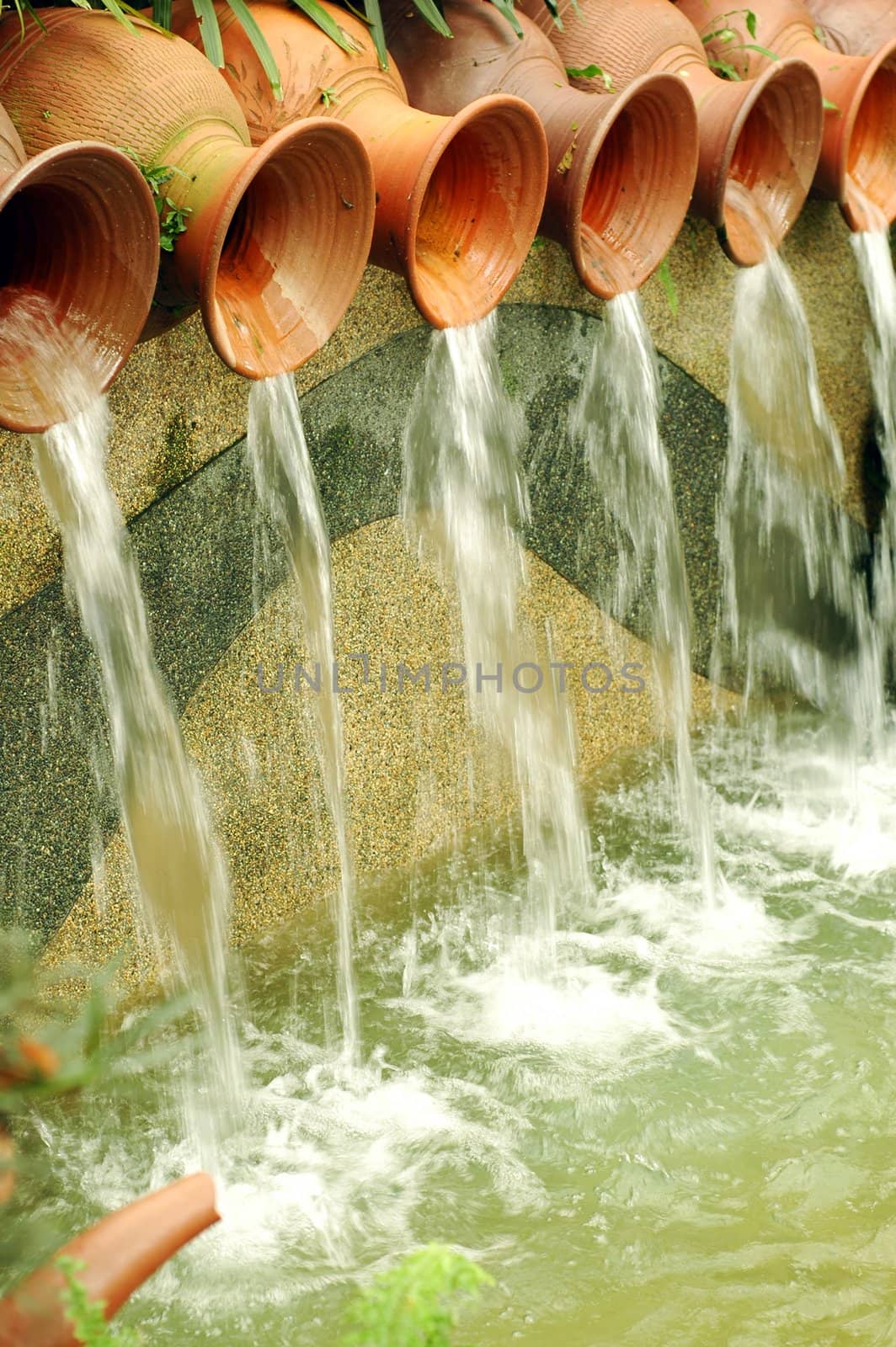 Water pots fountain in garden