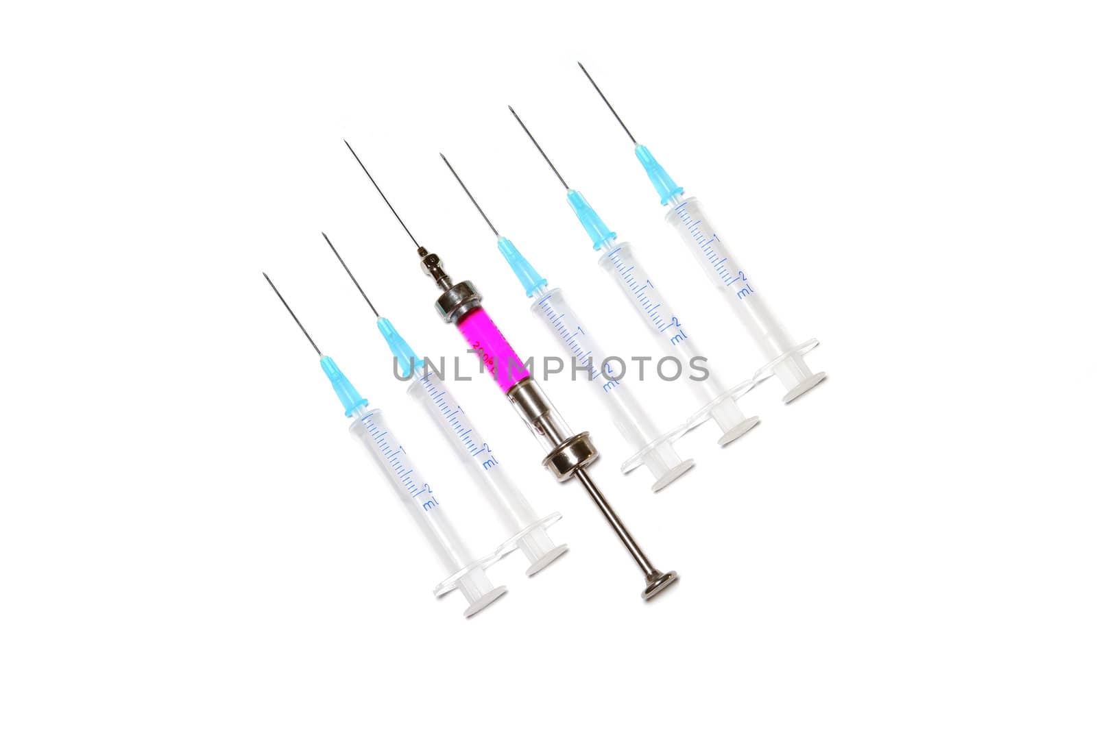 six syringes in row on white background