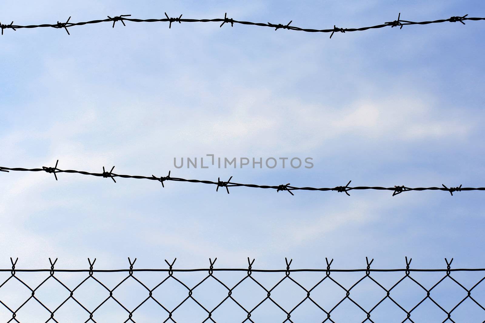 wired fence with barbed wire