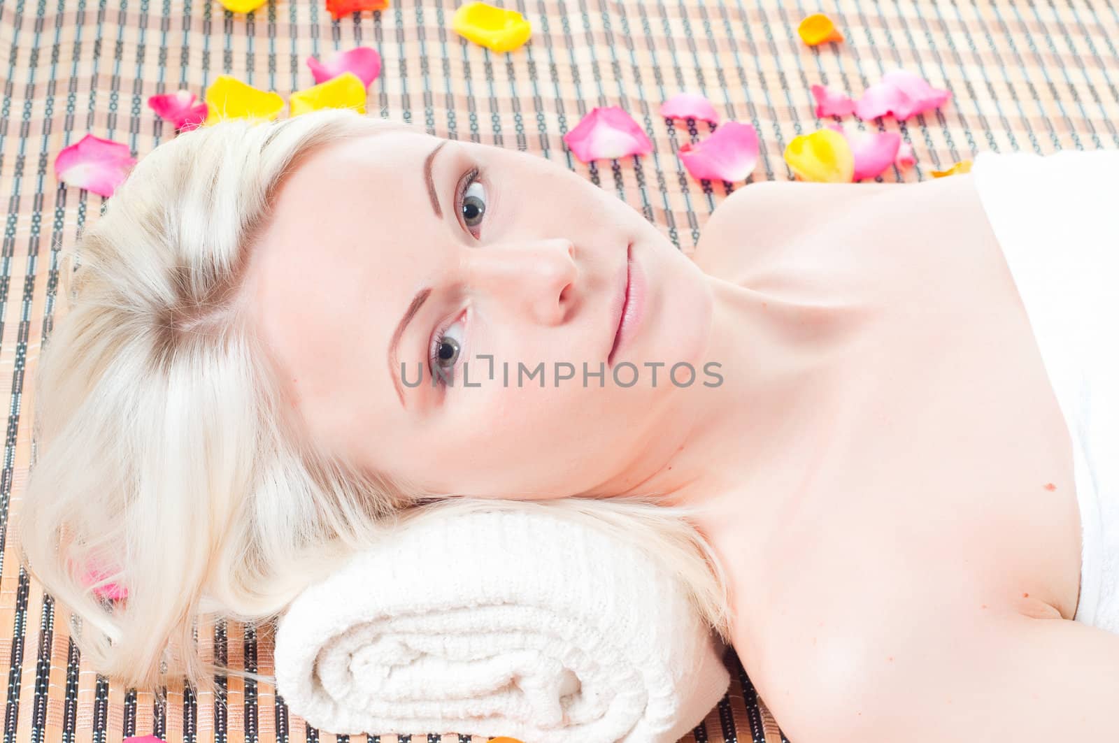Shot of young sexy woman getting spa treatment isolated on white