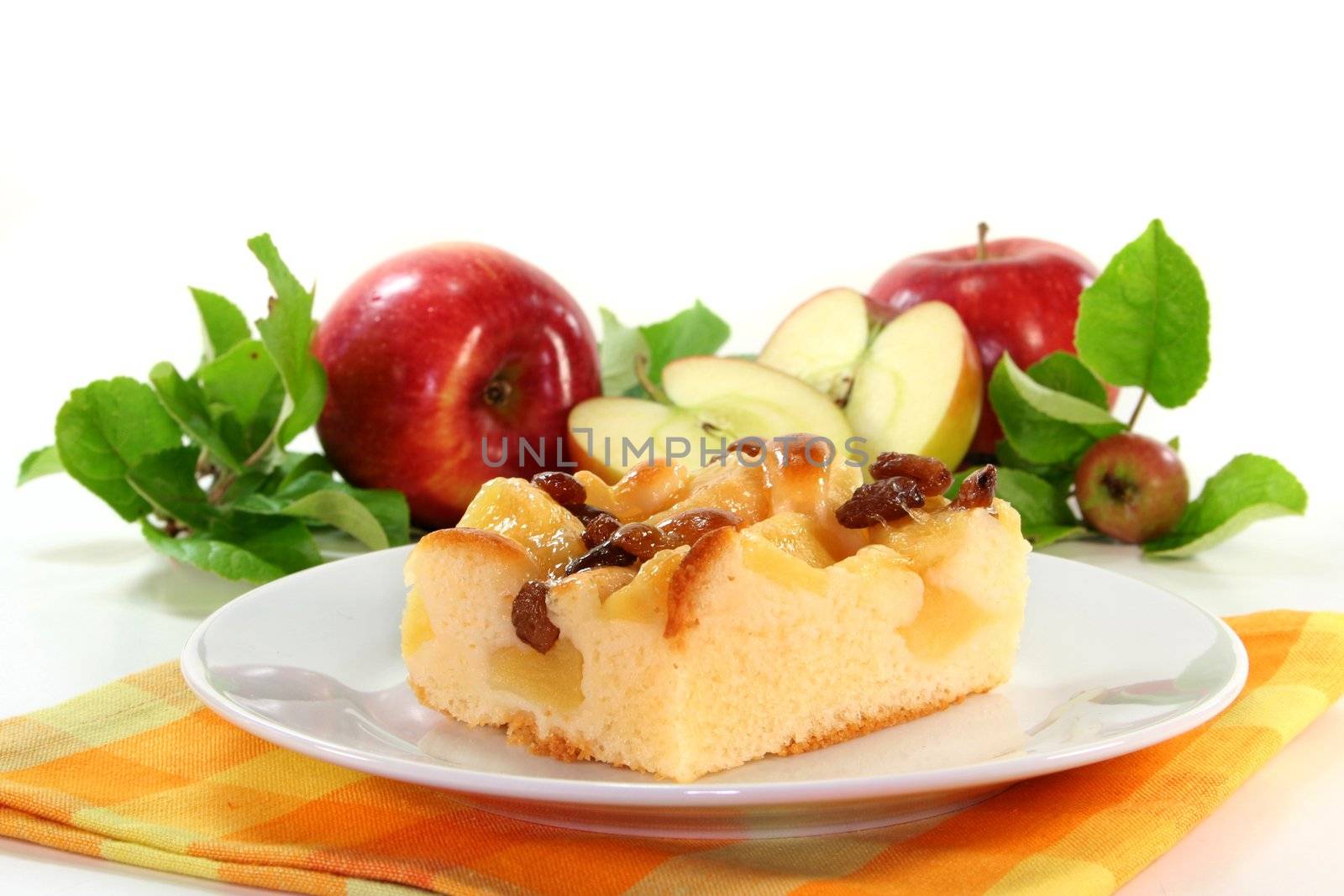 a piece of apple pie on a white plate
