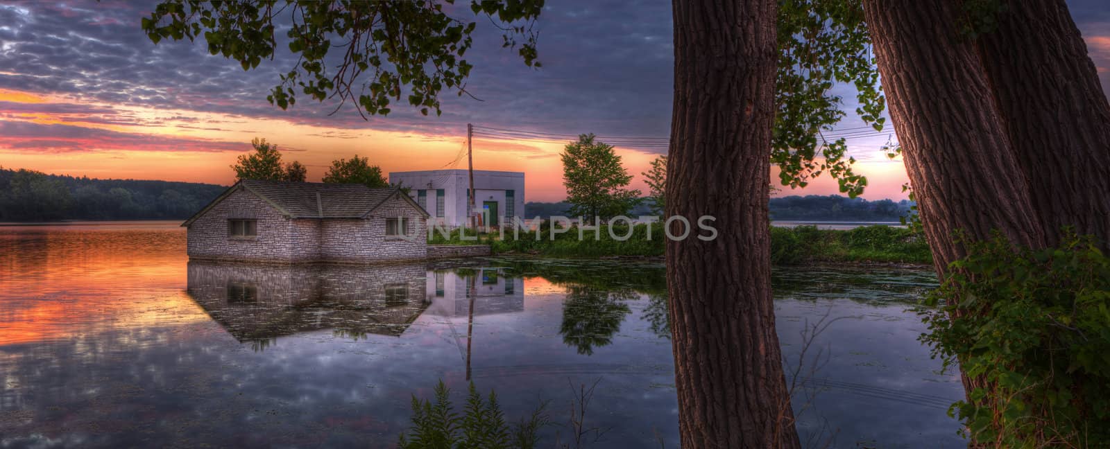 Sunrise panorama of a pump house utility building by Coffee999