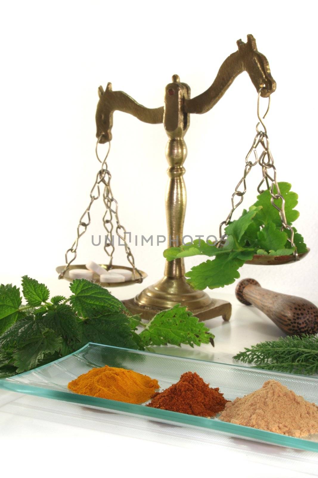 Pharmacists scale with tablets, Apothecary bottle and fresh herbs