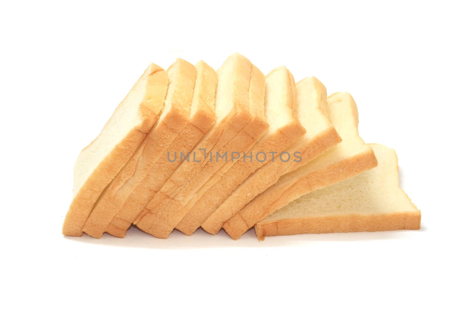 Slices of bread on white background