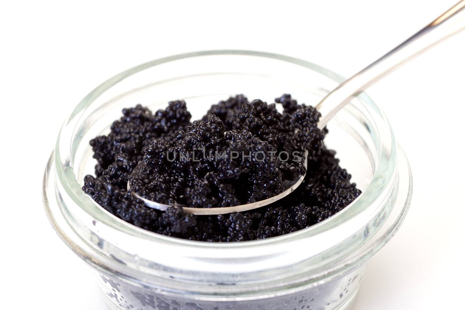 Black caviar on a spoon by Discovod