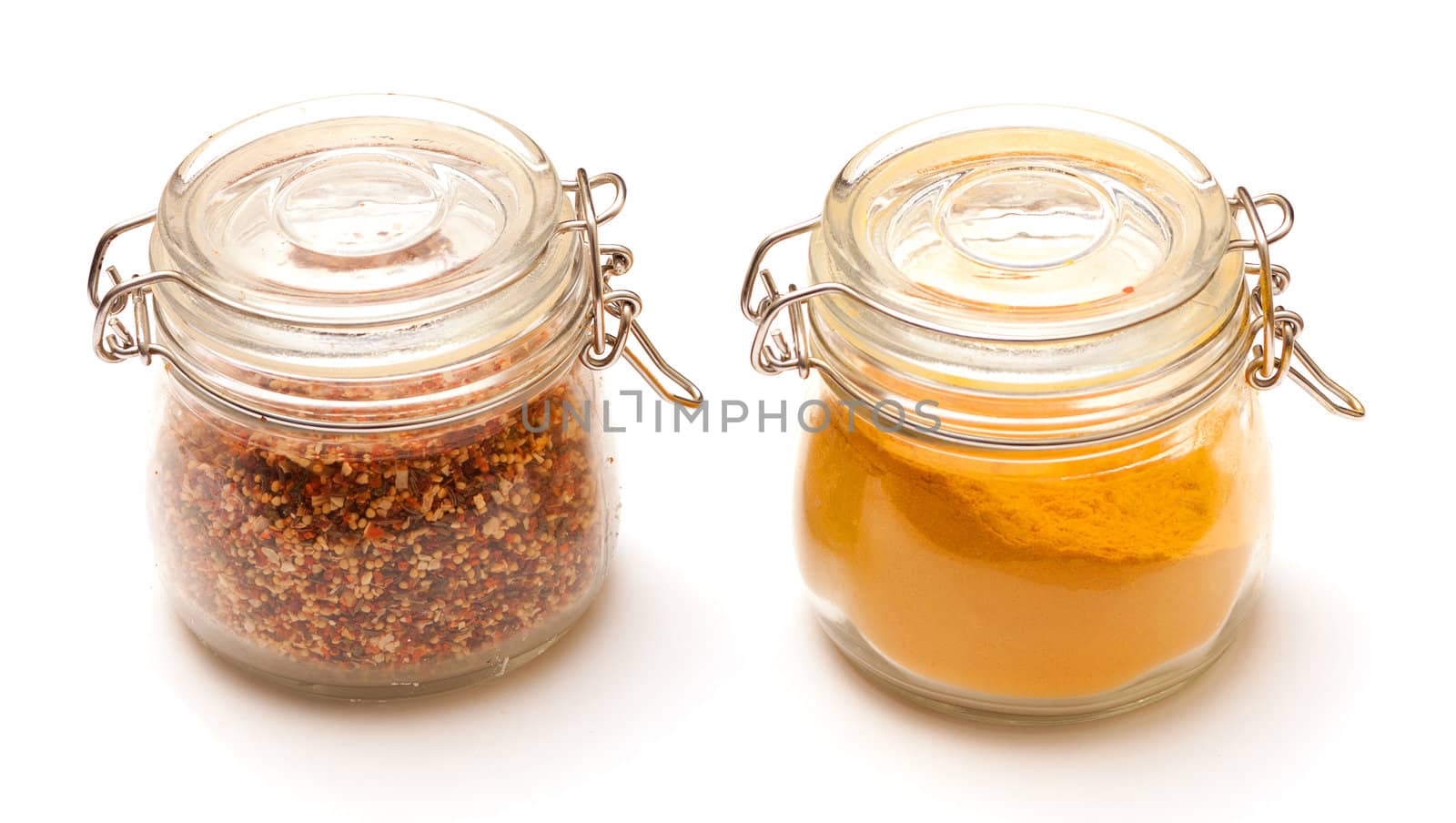 photo of multi-colored spices on white background