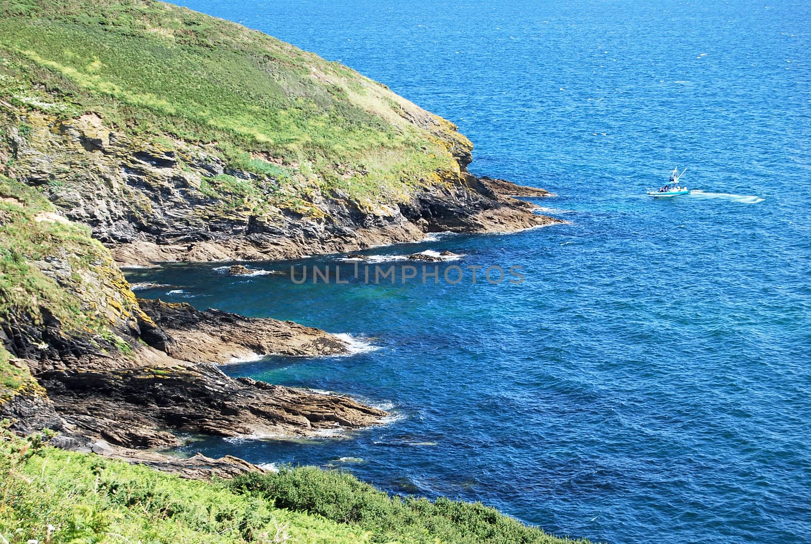 Blue Sea and Towering Cliffs in Cornwall England