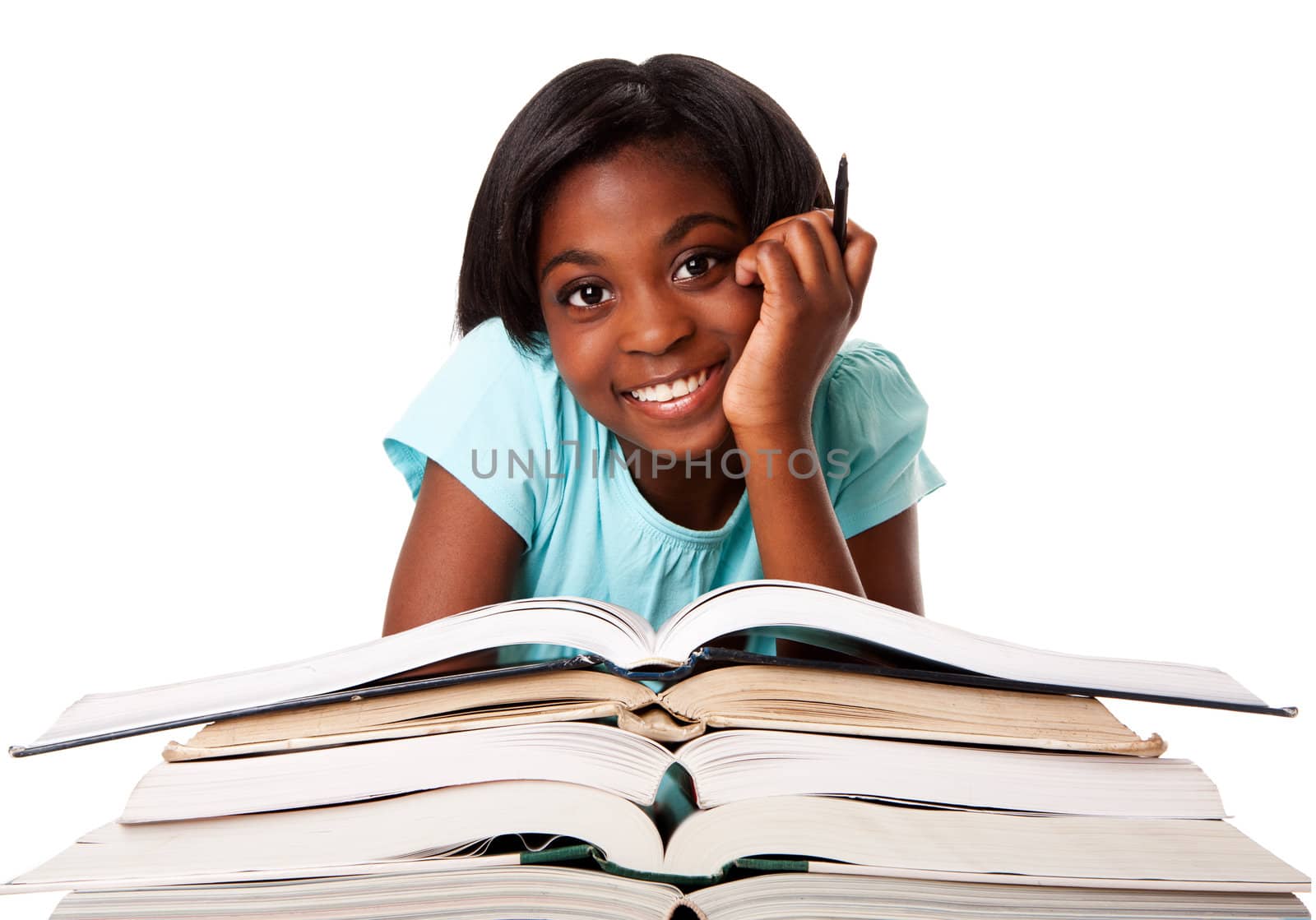 Beautiful happy smiling student with pen and a pile of open books doing homework, isolated.