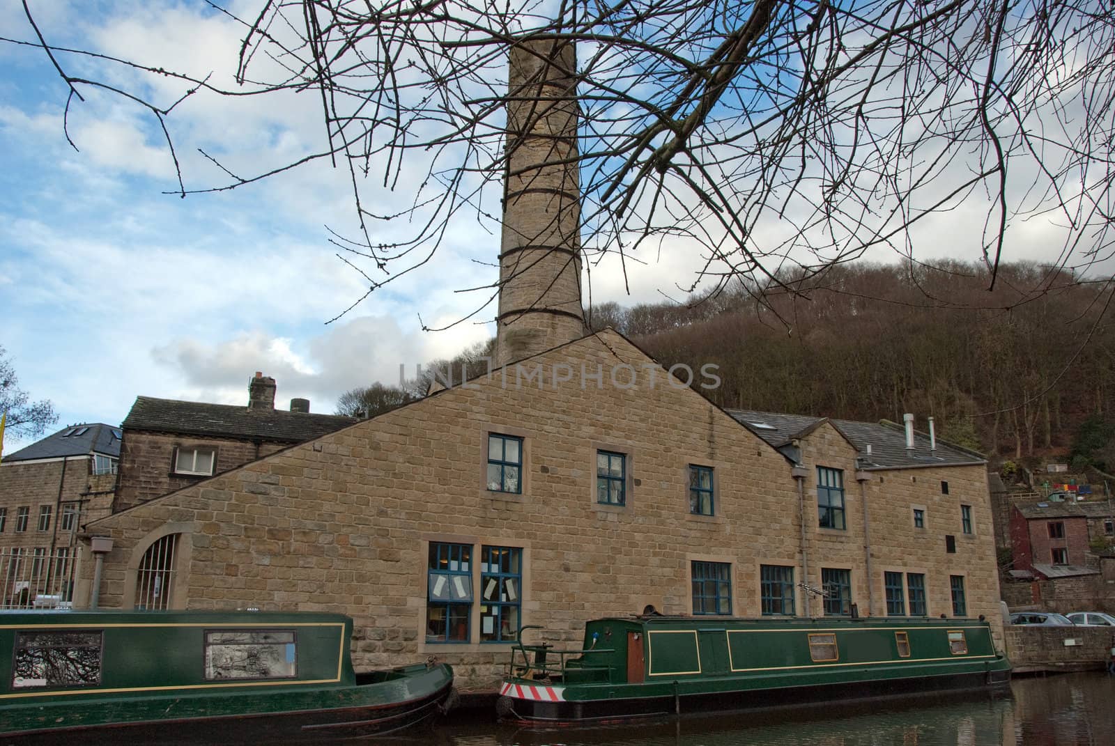 An Old Woolen Mill and Barges on the Rochdale Canal at Hebden Bridge Yorkshire