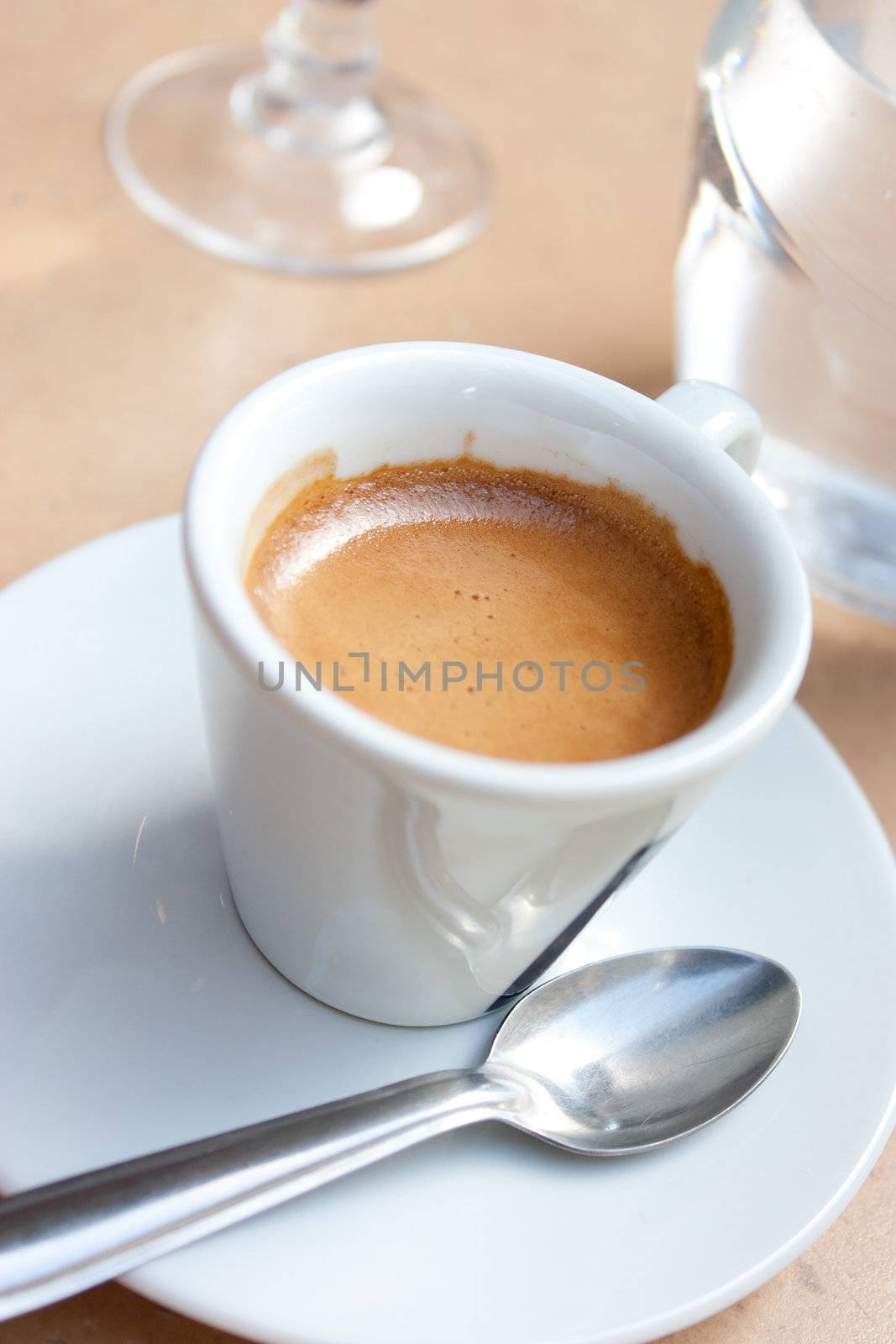 white cup of coffee, espresso and glass of water