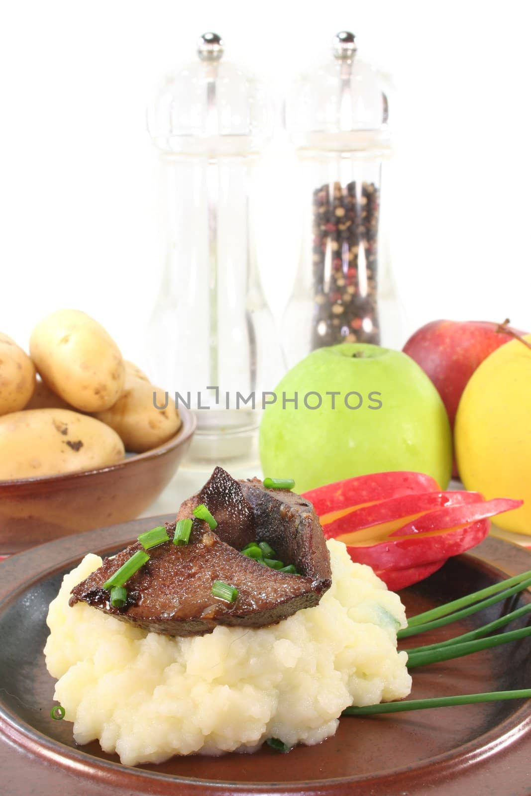 fried liver with mashed potatoes, apple and chives
