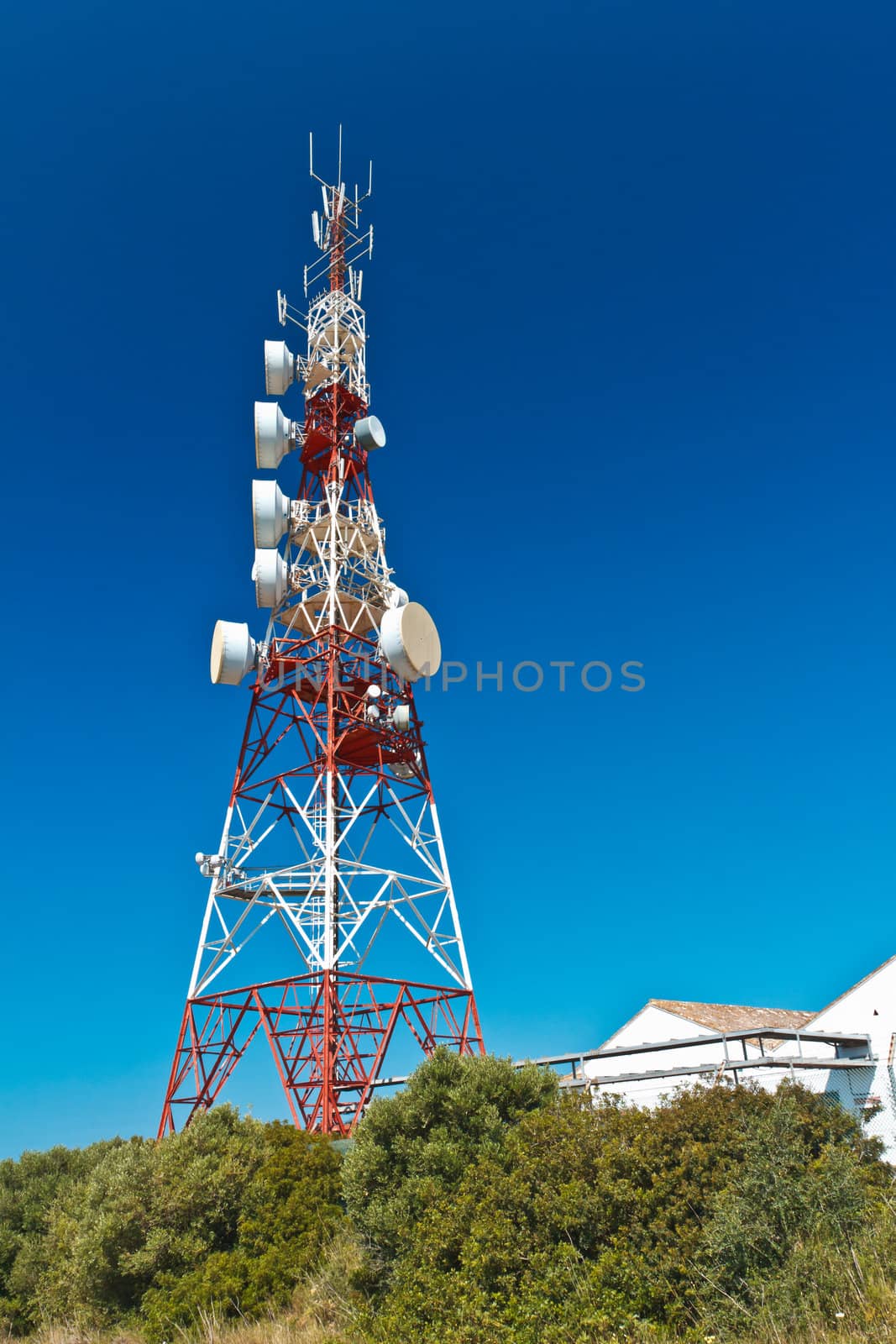 Communications tower with a beautiful blue sky