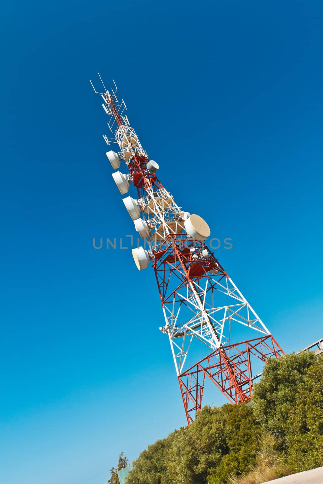 Communications tower with a beautiful blue sky