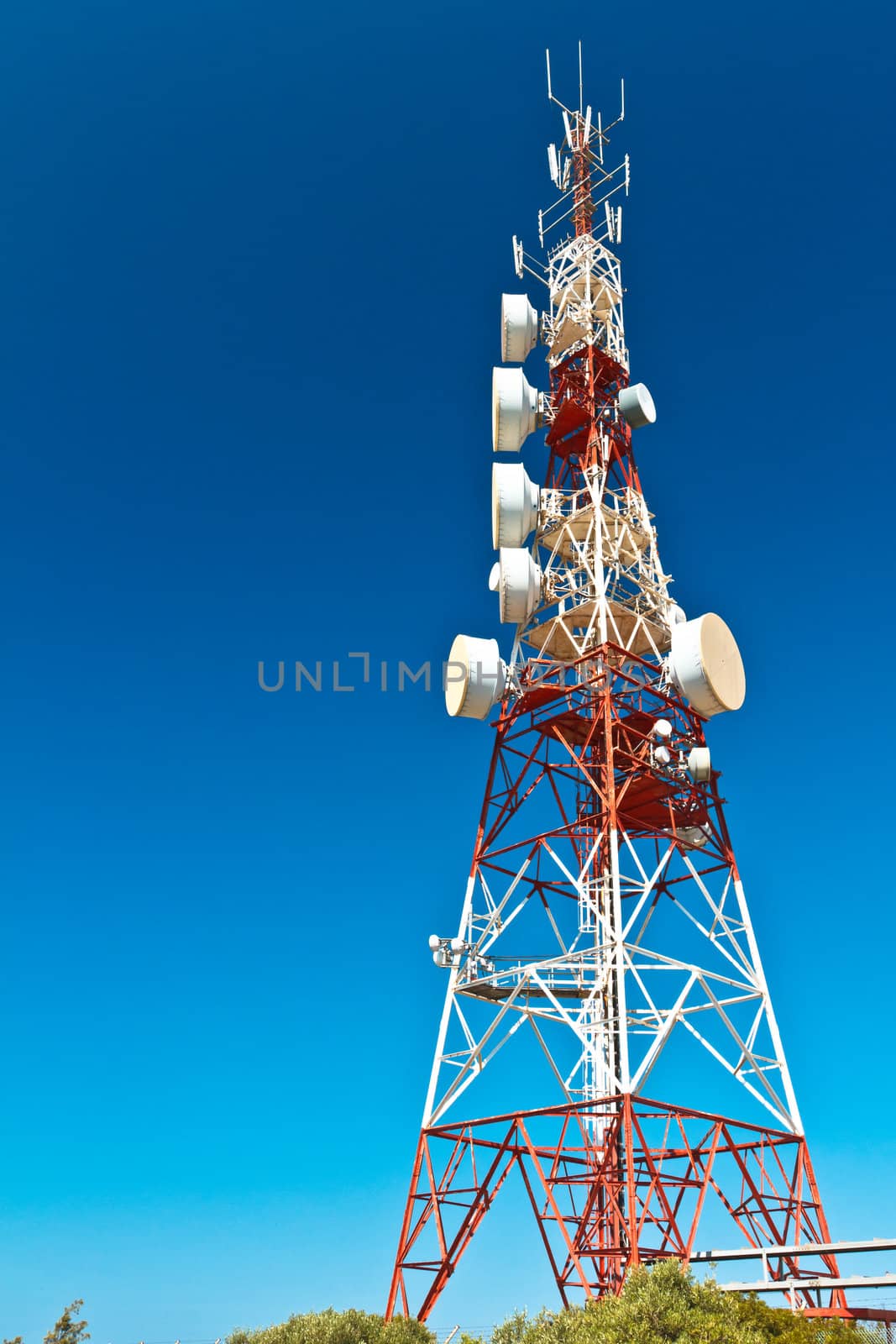 Communications tower with a beautiful blue sky