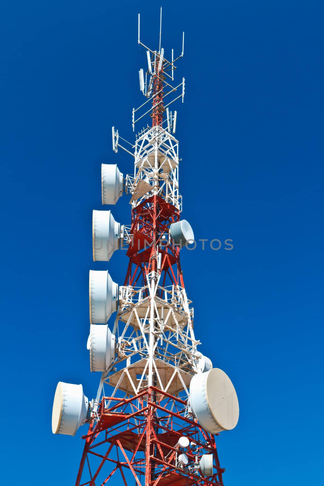 Communications tower with a beautiful blue sky