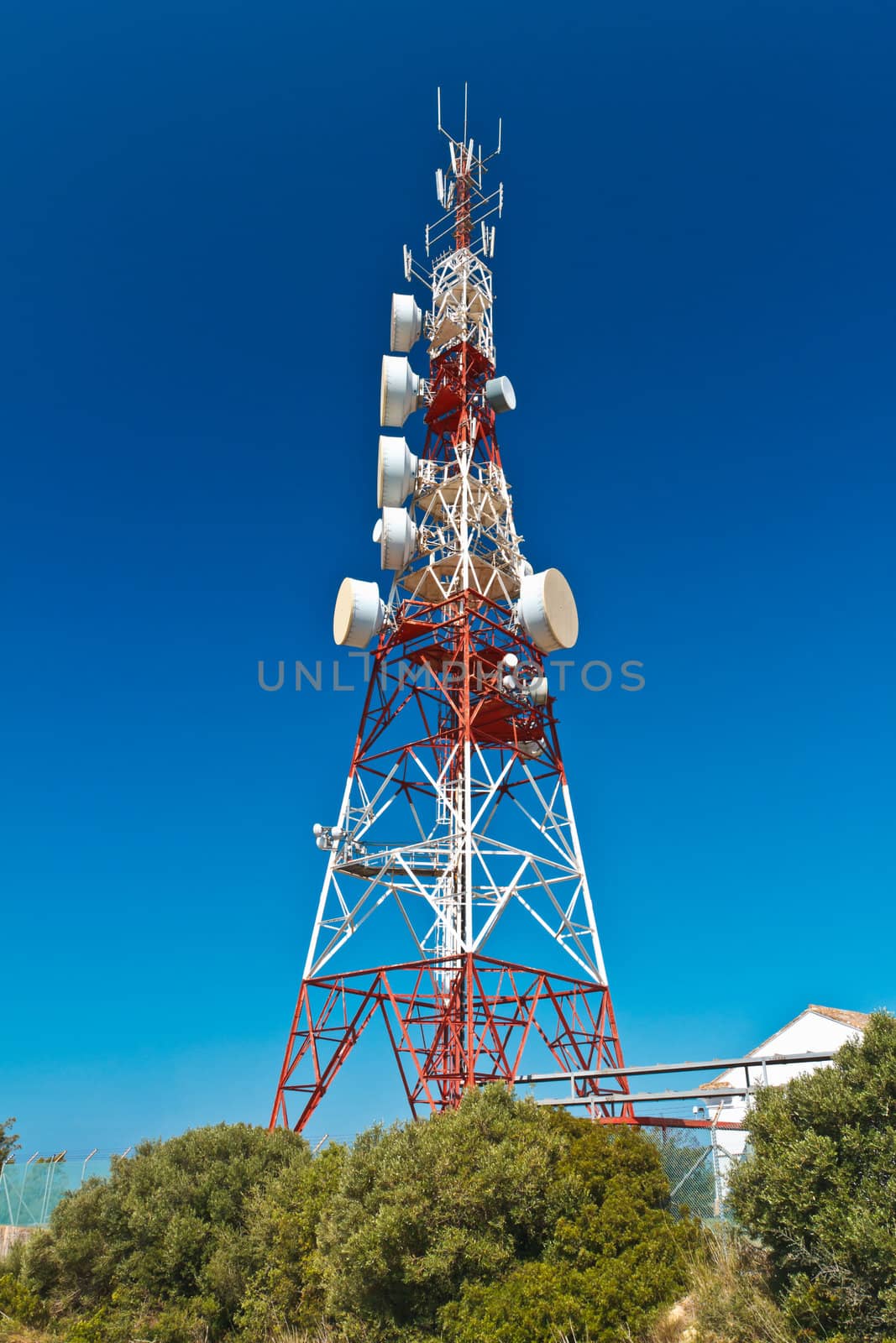 Communications tower with a beautiful blue sky