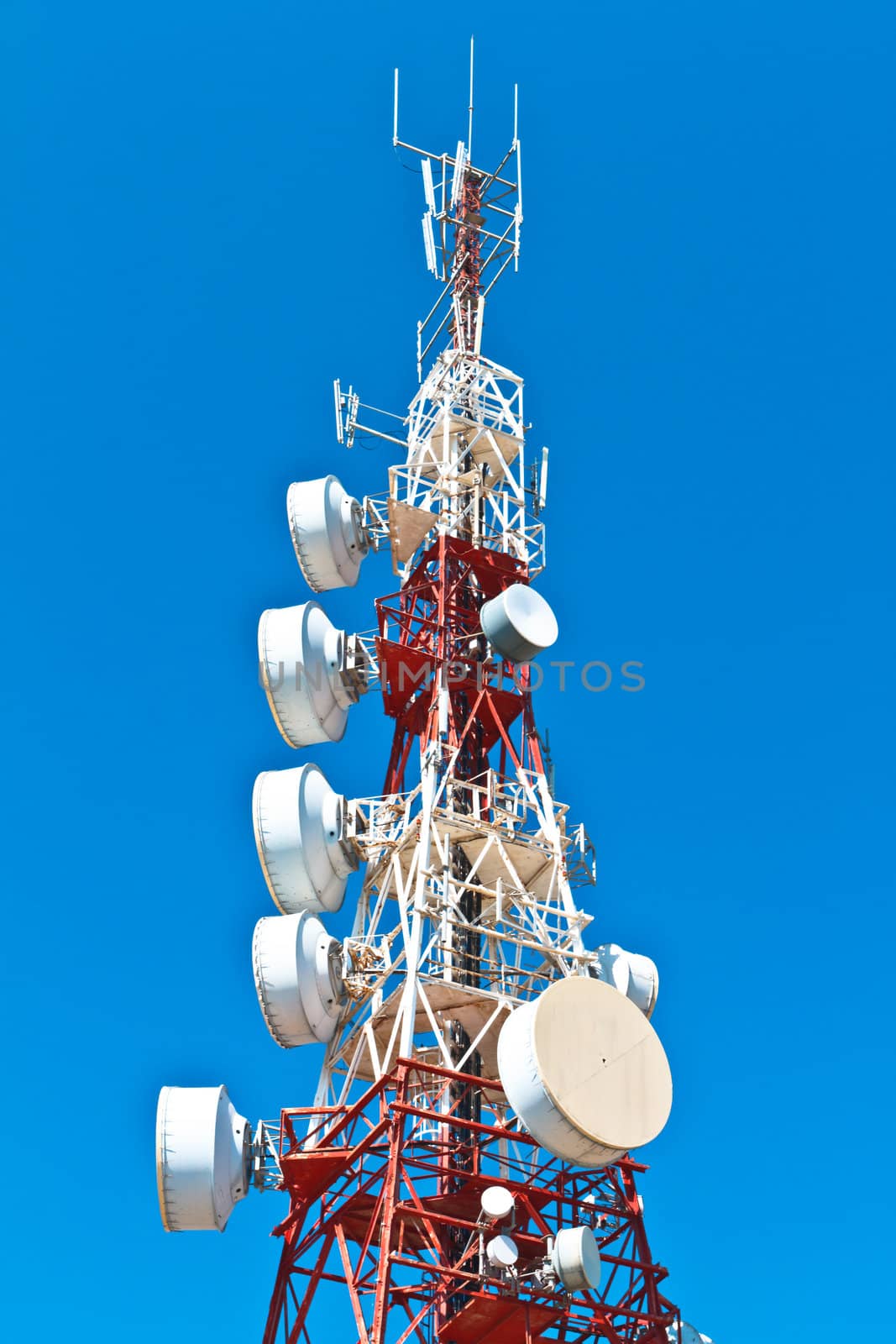 Communications tower with a beautiful blue sky