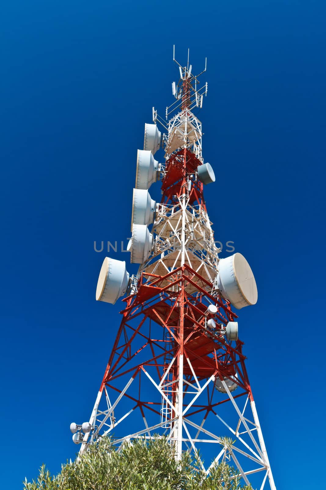 Communications tower with a beautiful blue sky